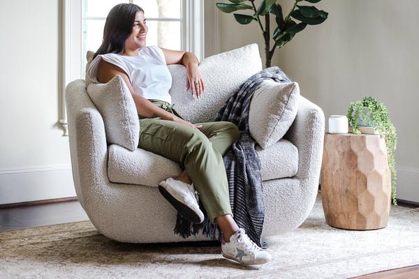 front view of the park swivel armchair in bouclé
