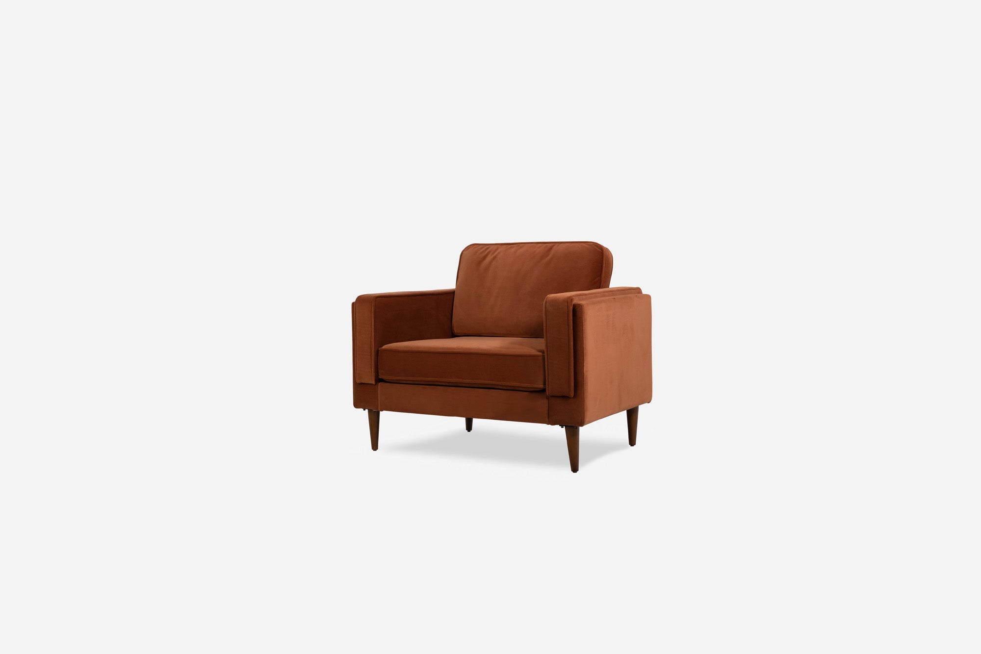 albany armchair shown in rust velvet with walnut legs