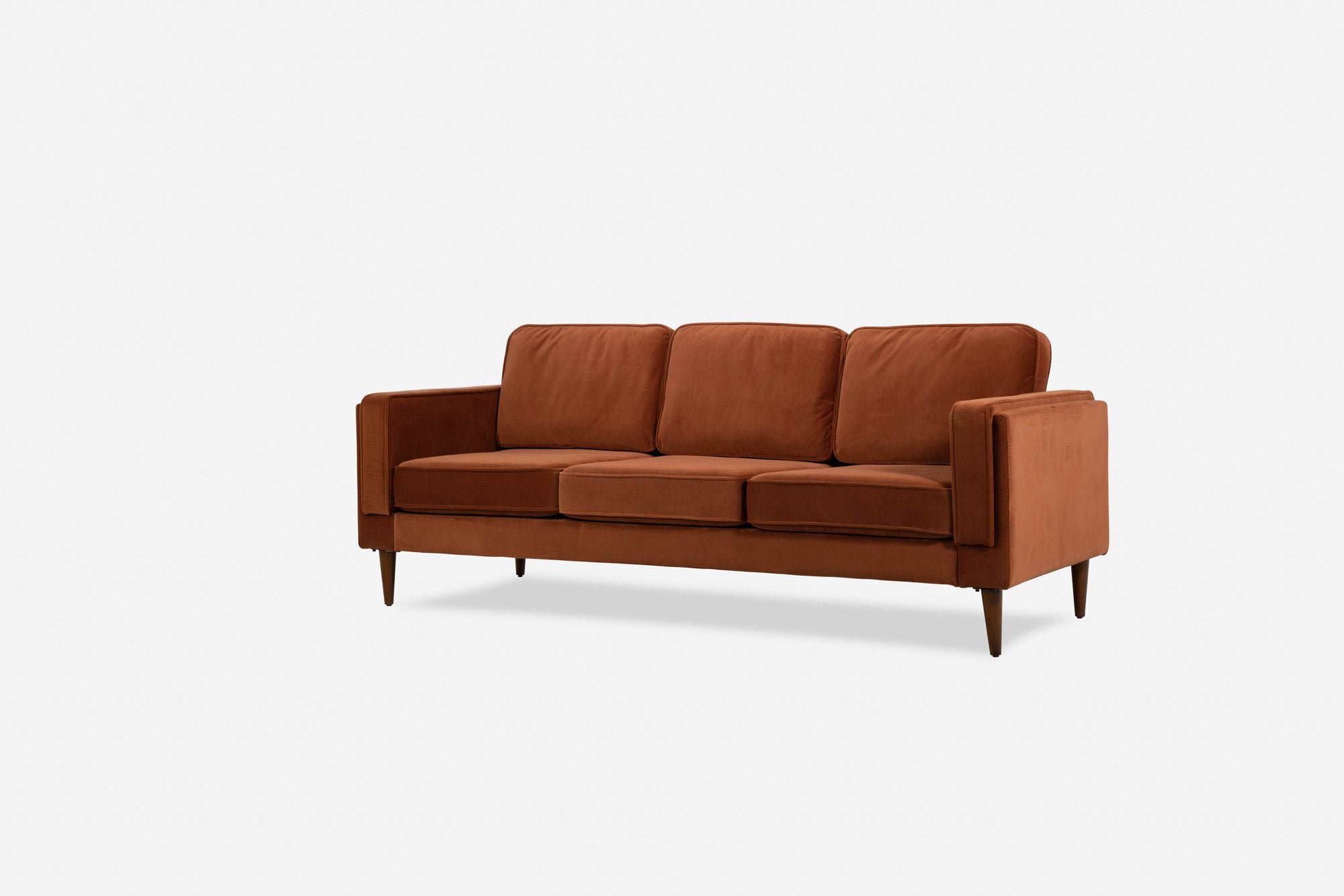 albany sofa shown in rust velvet with walnut legs