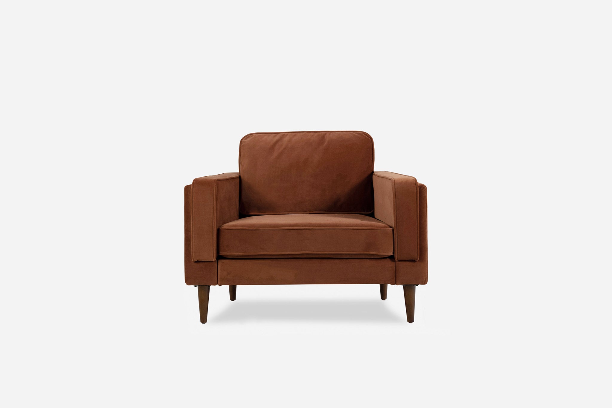 albany armchair shown in rust velvet with walnut legs
