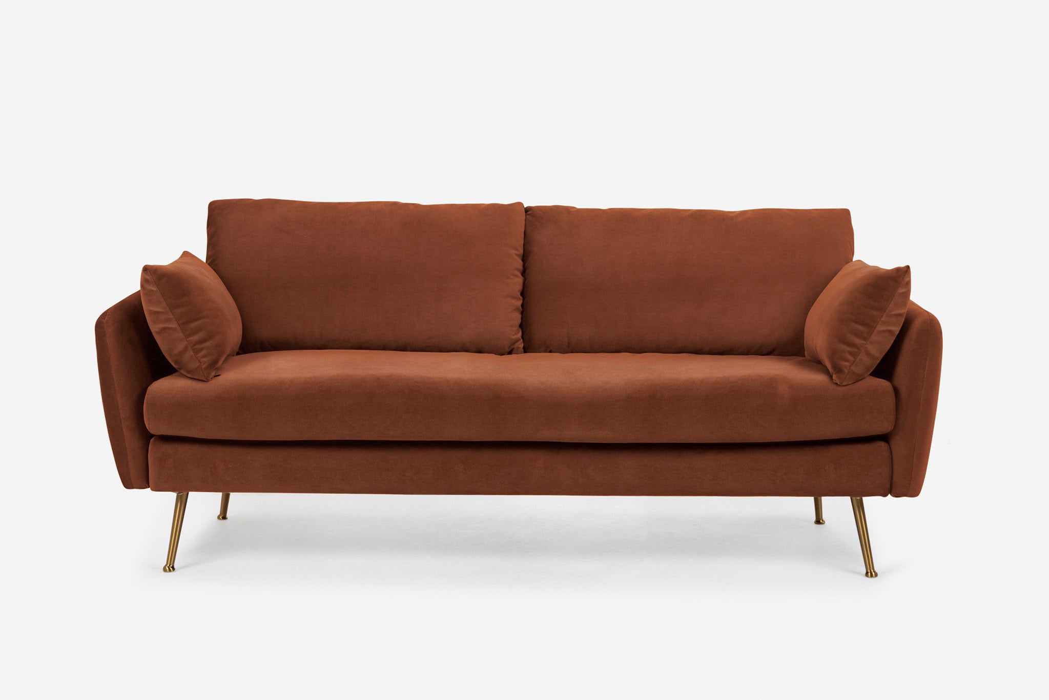 park sofa shown in rust velvet with gold legs