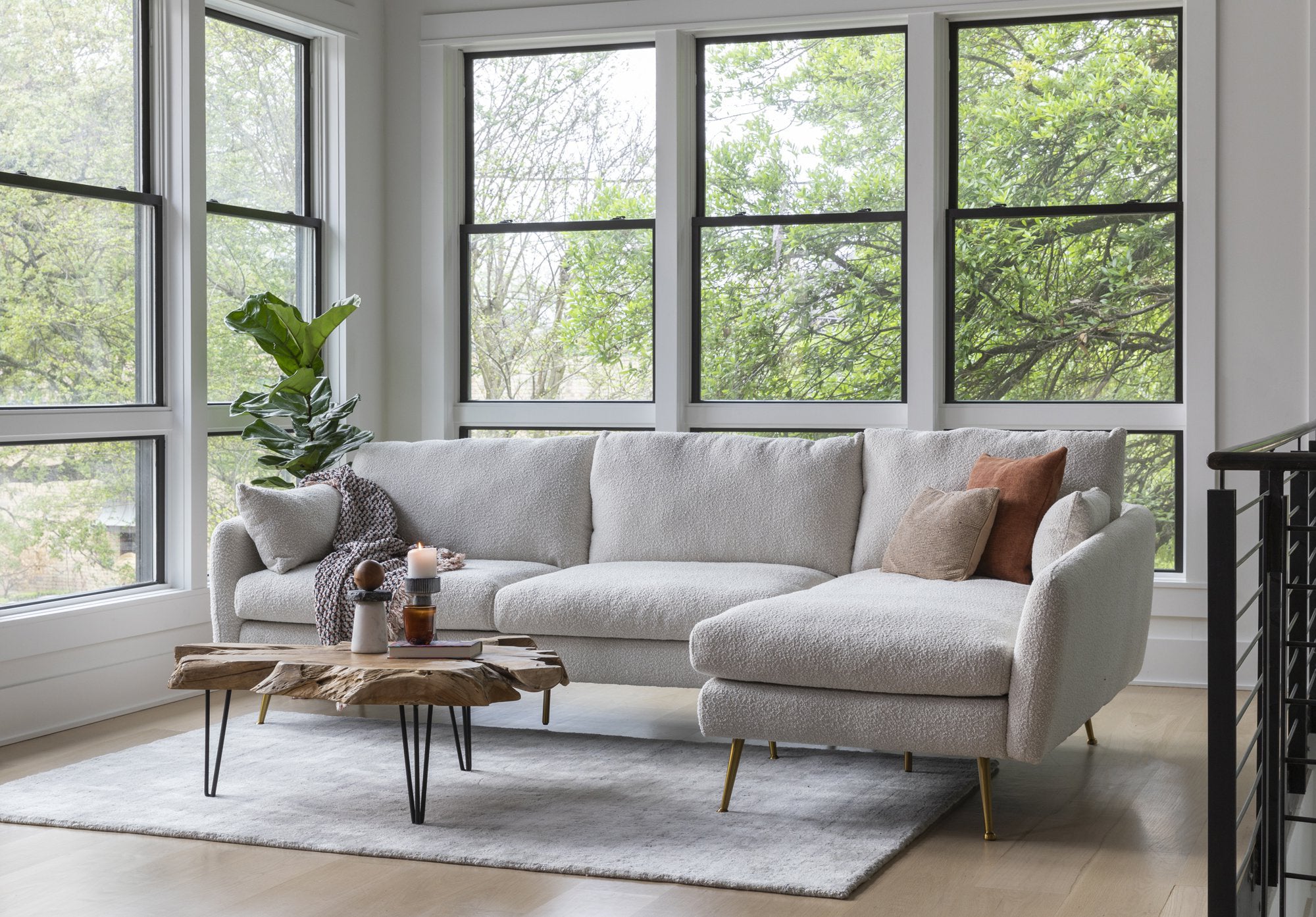 park sectional sofa shown in bouclé with gold legs right facing
