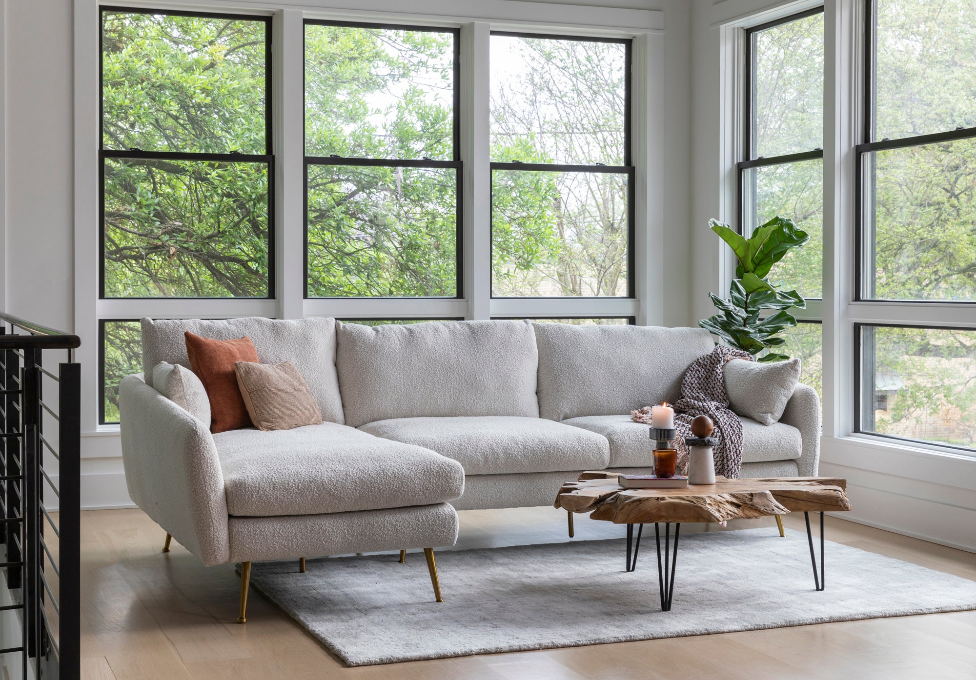 park sectional sofa shown in bouclé with gold legs left facing