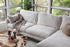 Bouclé gold black right facing | Park Sectional Sofa shown in Bouclé with gold legs with black legs right facing