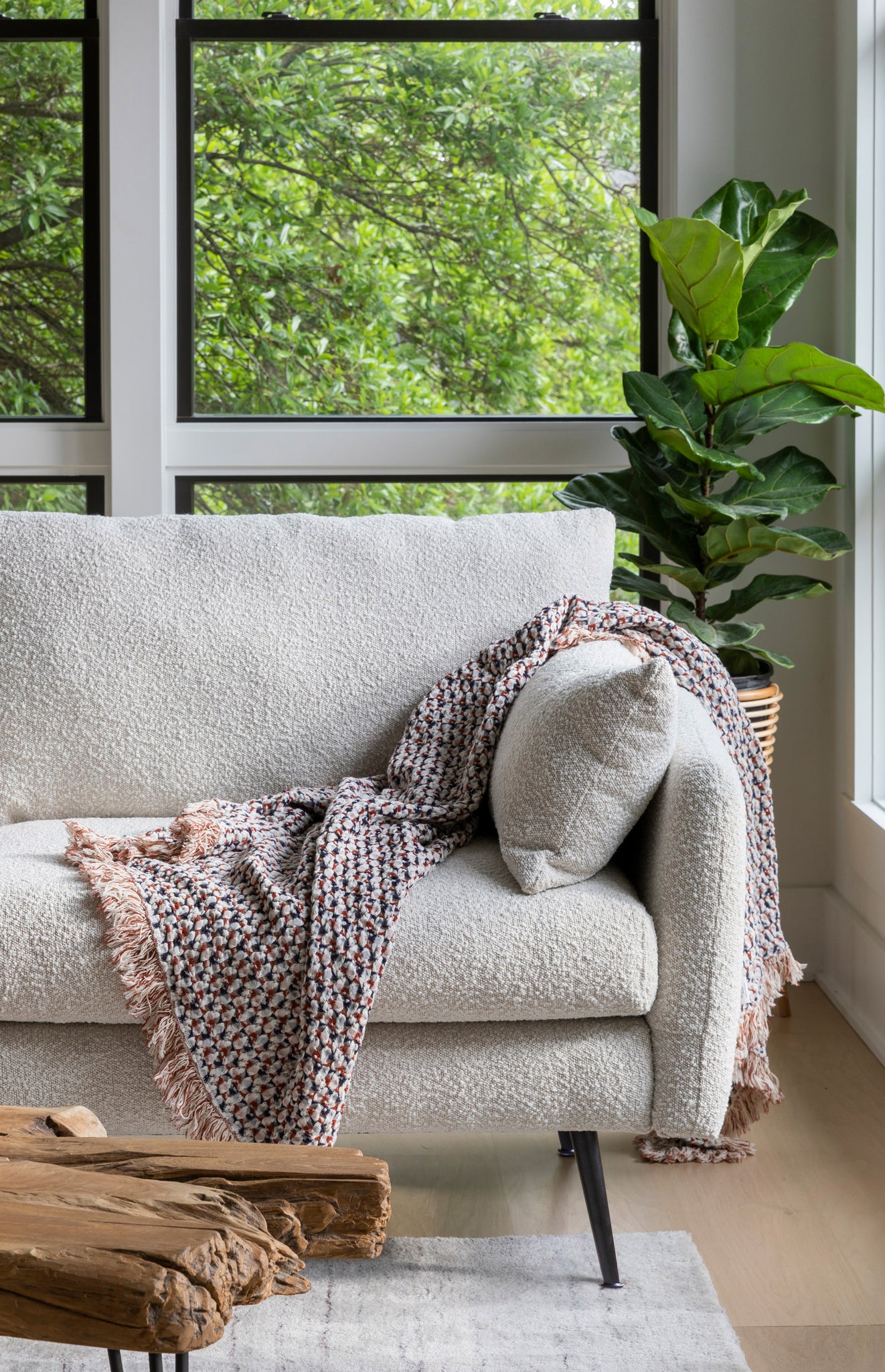 park armchair shown in bouclé with black legs