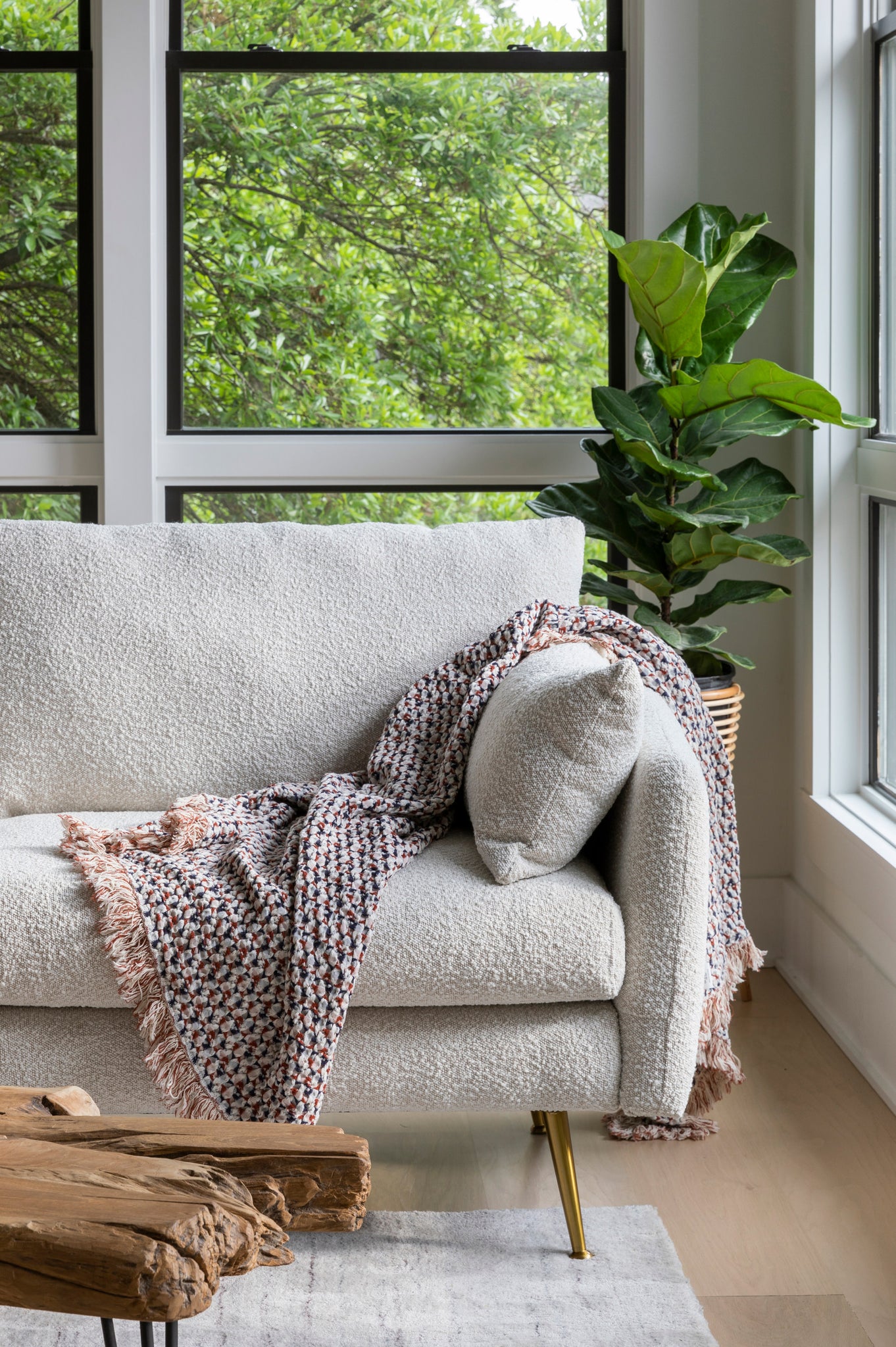 park armchair shown in bouclé with gold legs