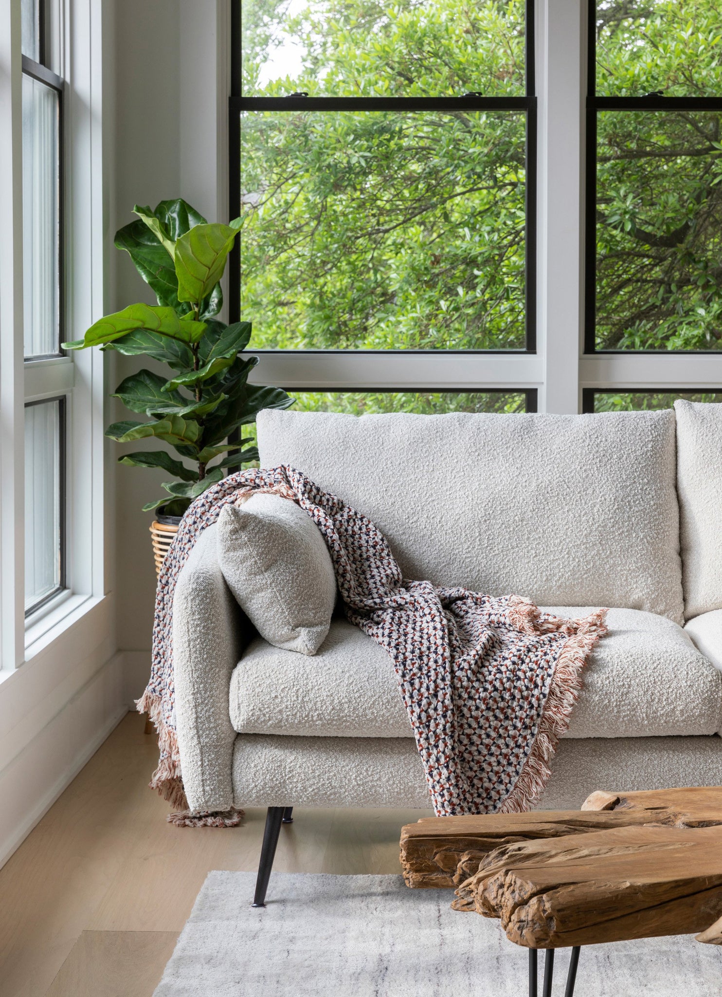 park sectional sofa shown in bouclé with black legs right facing
