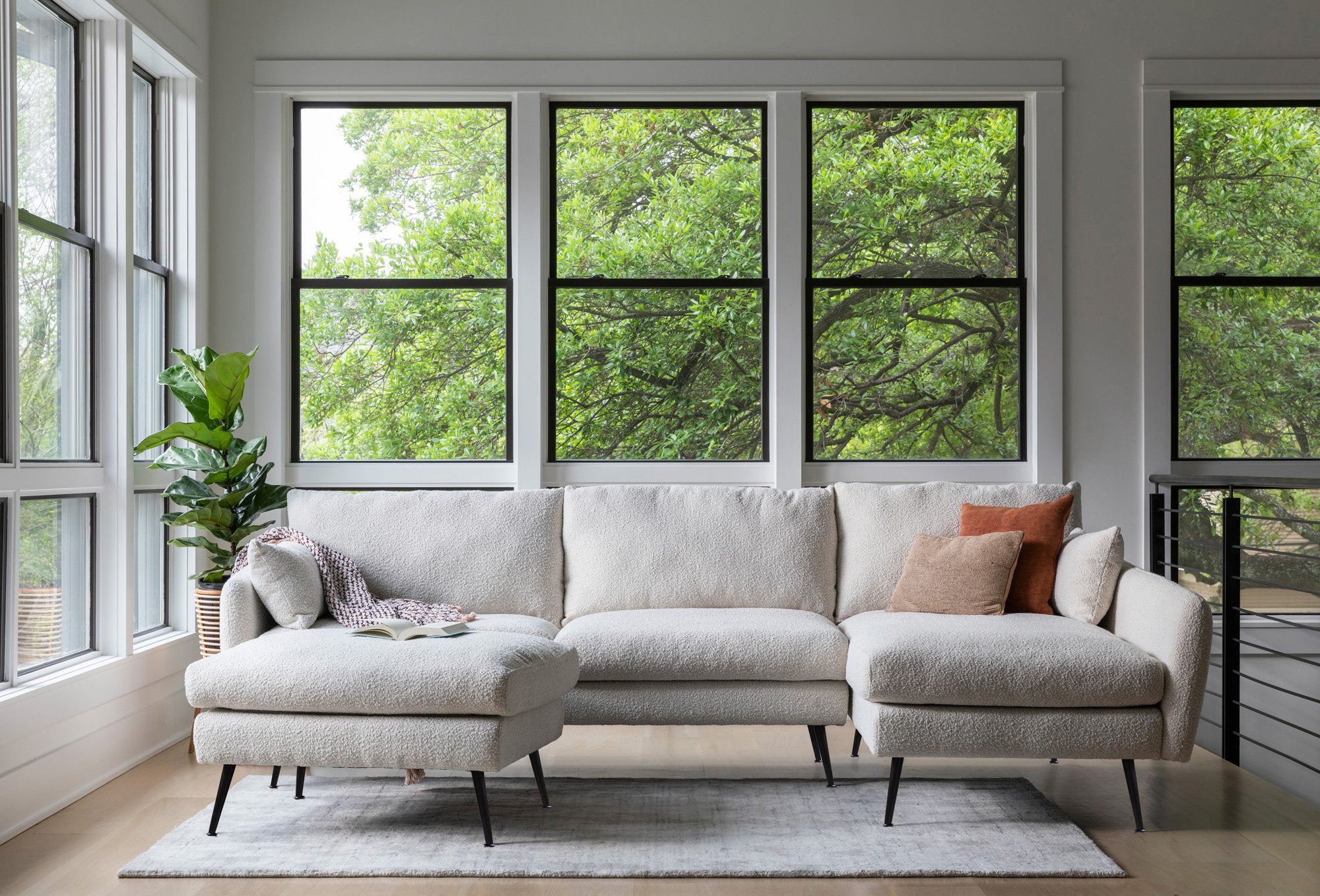 park sectional sofa shown in bouclé with black legs right facing