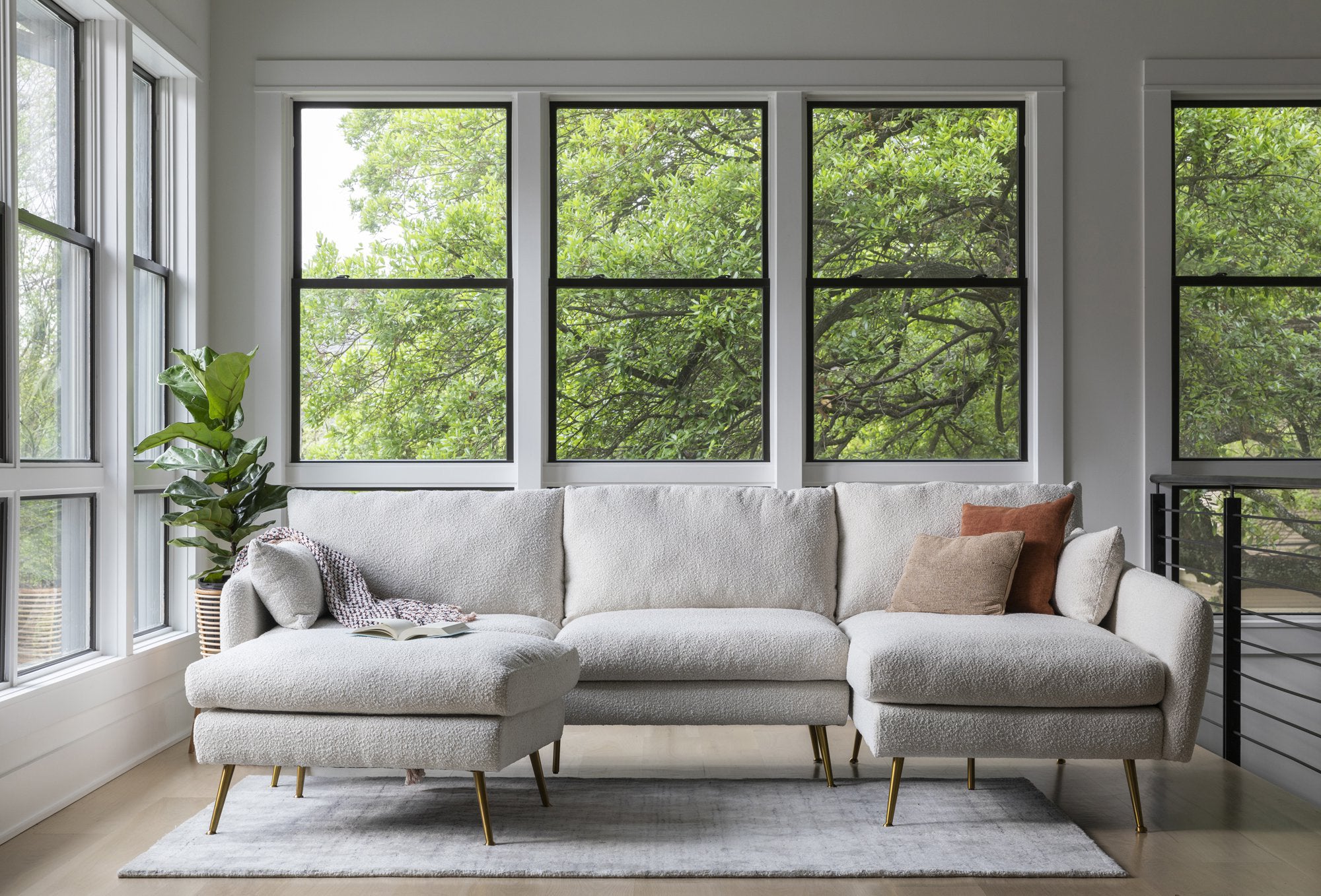 park sectional sofa shown in bouclé with gold legs right facing