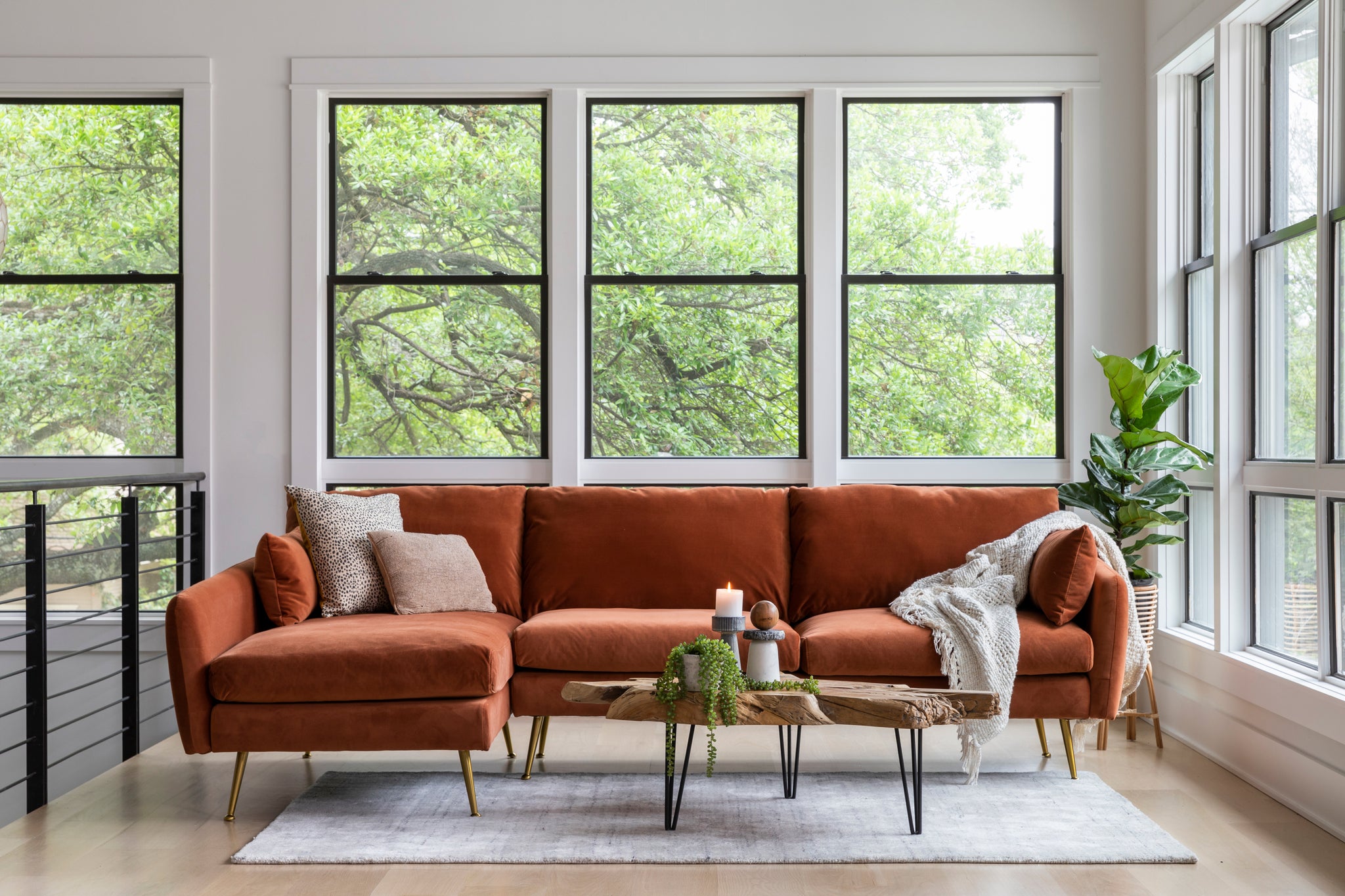 park sectional sofa shown in rust velvet with gold legs with black legs left facing