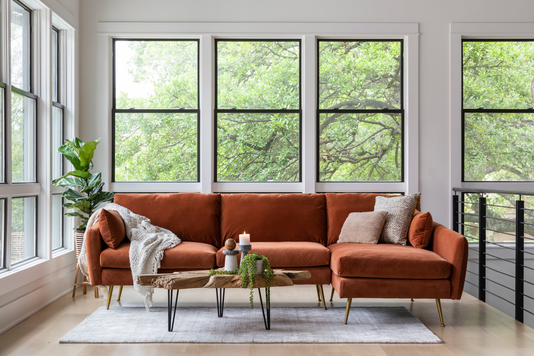 park sectional sofa shown in rust velvet with gold legs with black legs right facing