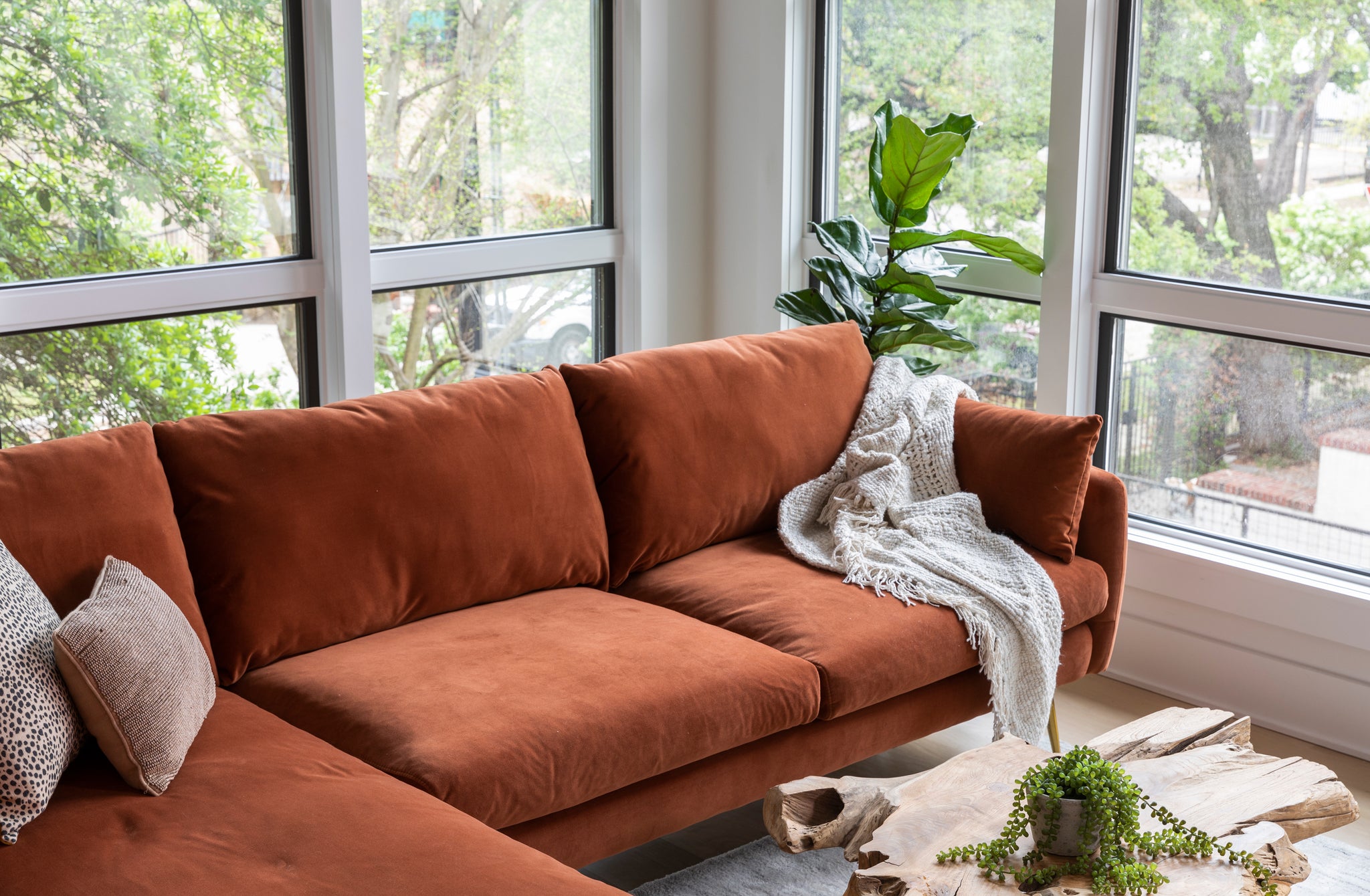 park sectional sofa shown in rust velvet with gold legs with black legs left facing