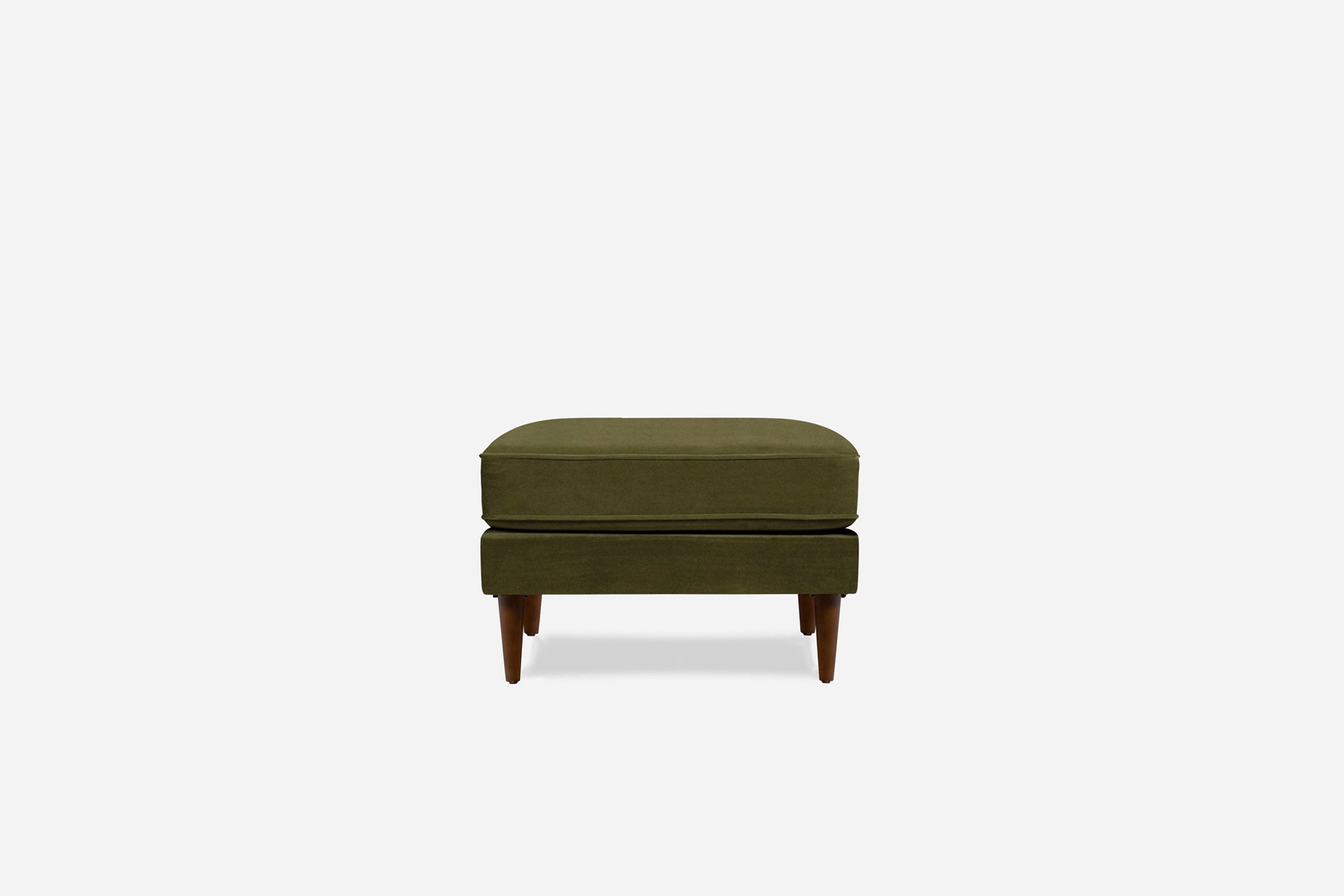 albany ottoman shown in olive velvet with walnut legs