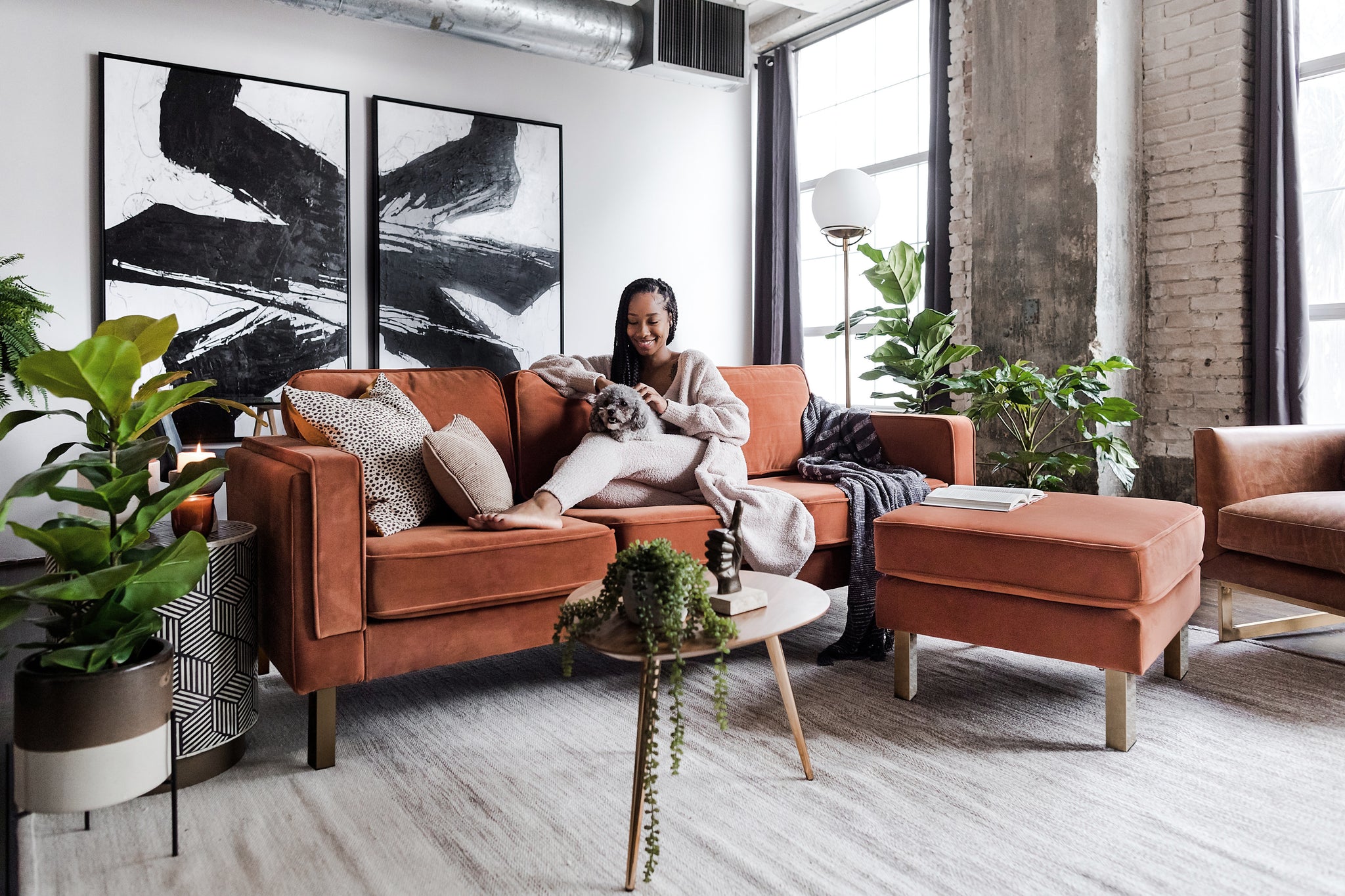 albany ottoman shown in rust velvet with gold legs