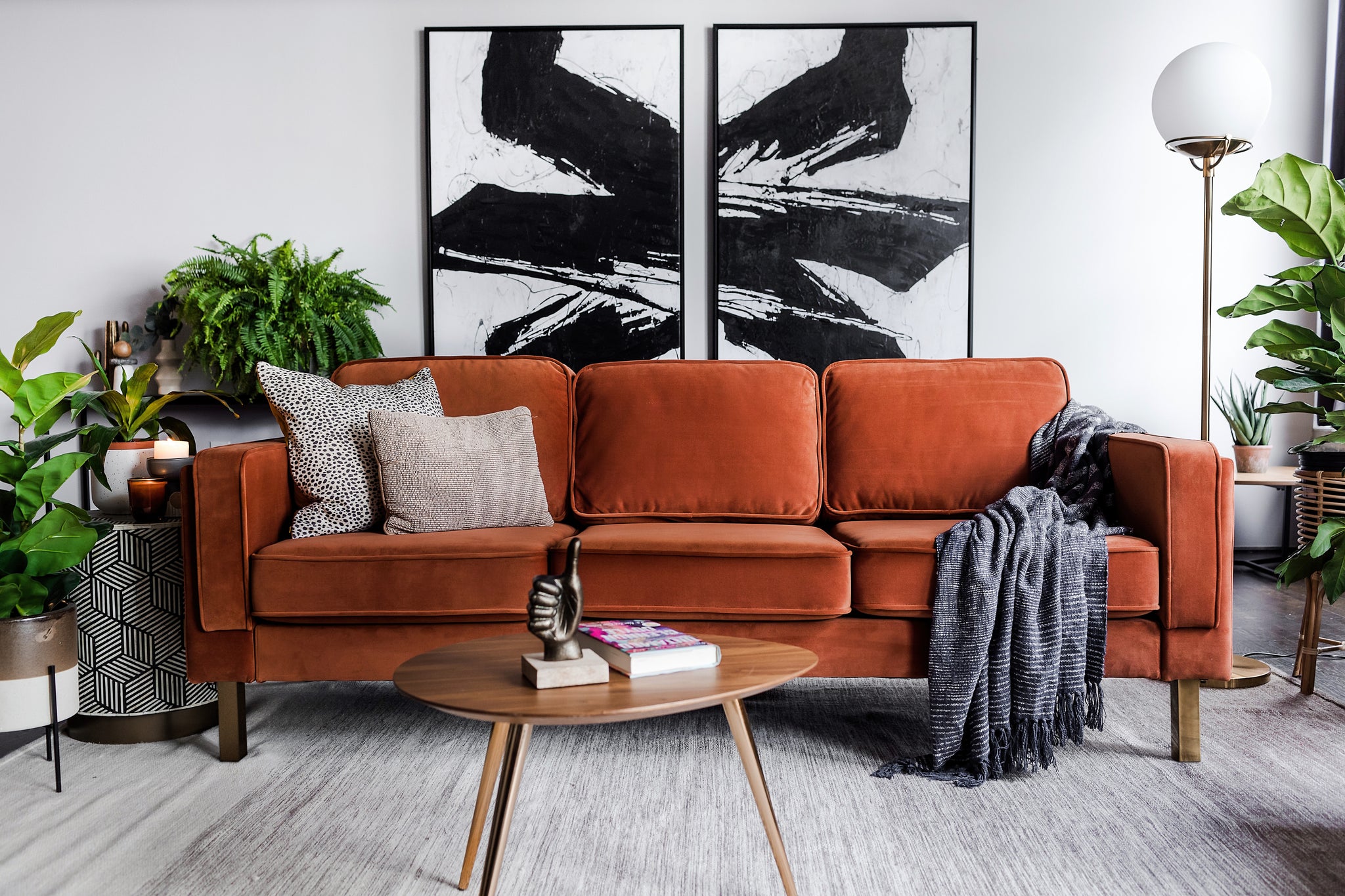 albany sofa shown in rust velvet with gold legs