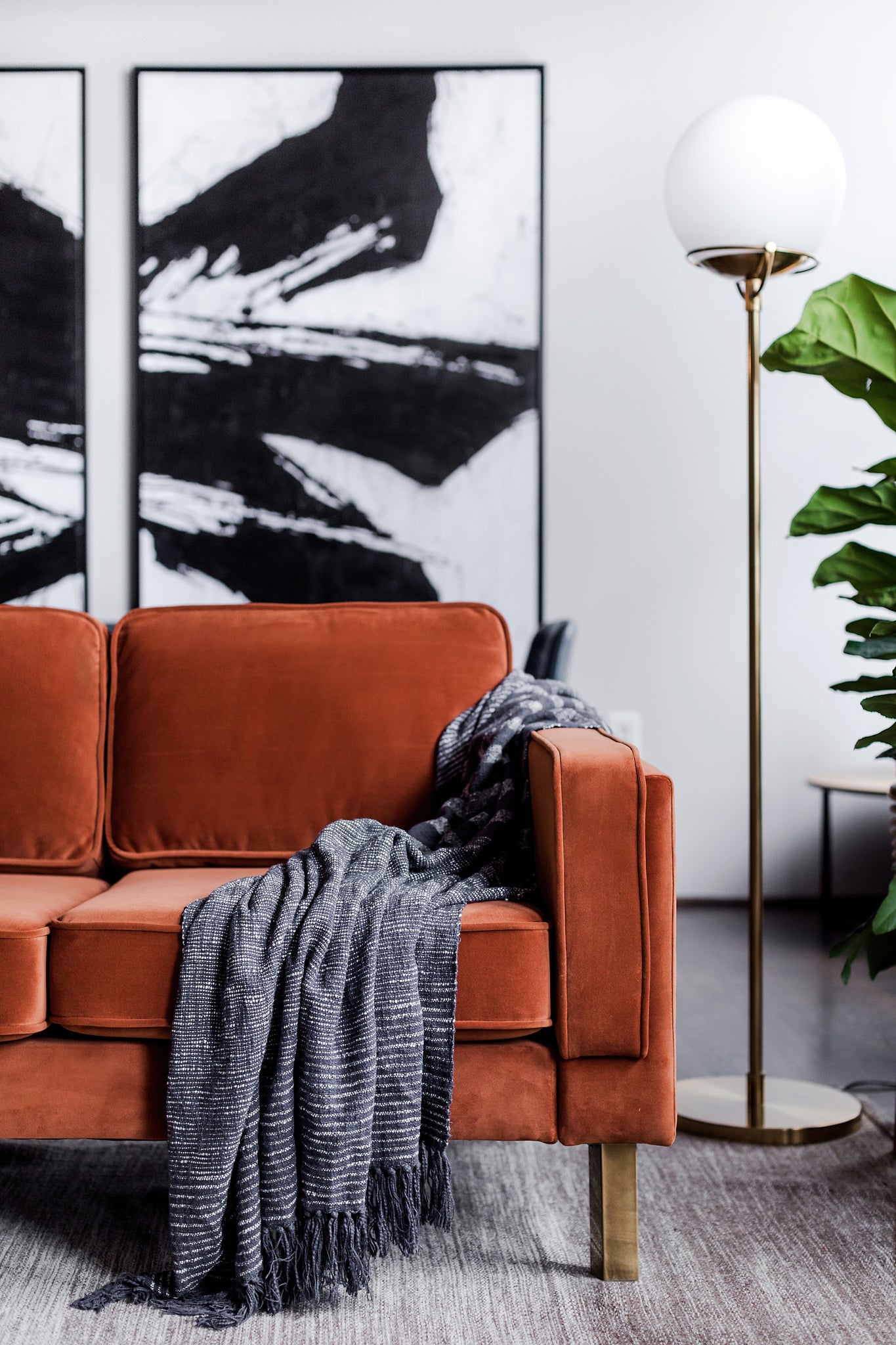 albany sofa shown in rust velvet with gold legs