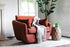 Rust velvet | Park swivel armchair in rust velvet with a white throw