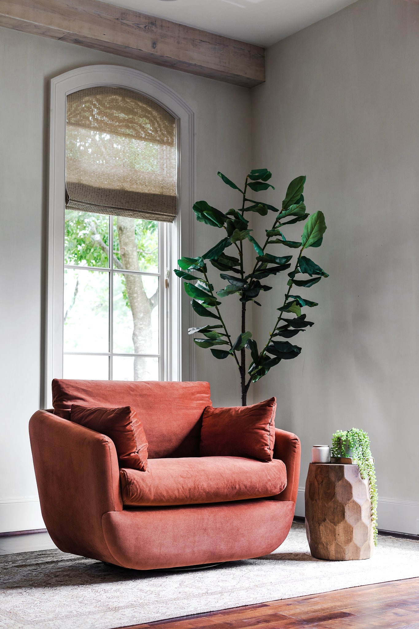 park swivel armchair in rust velvet in a living room setting