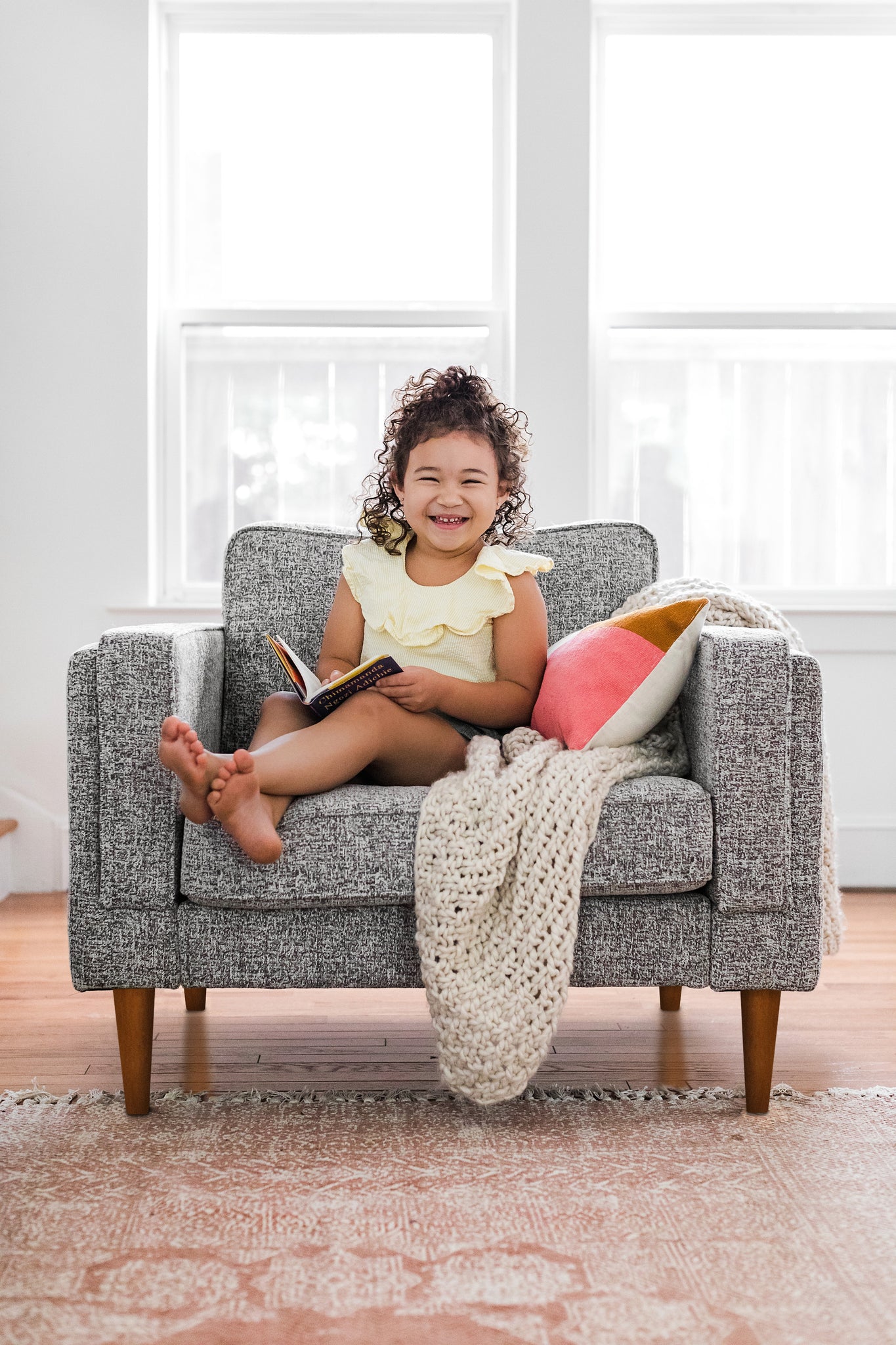 albany armchair shown in grey fabric with walnut legs