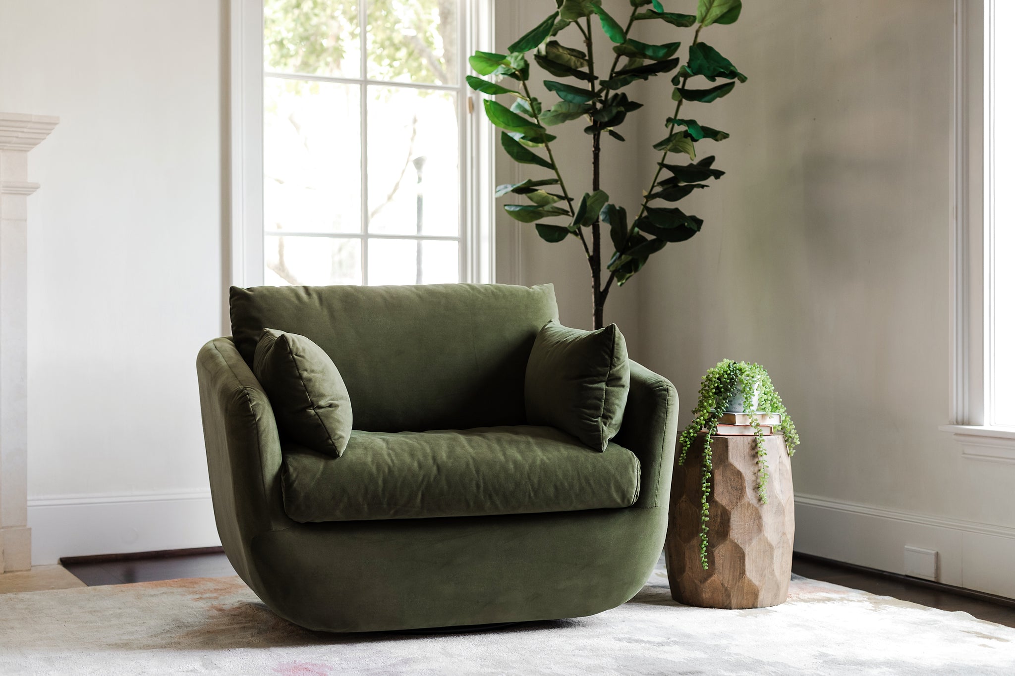 park swivel armchair in olive velvet in a living room setting