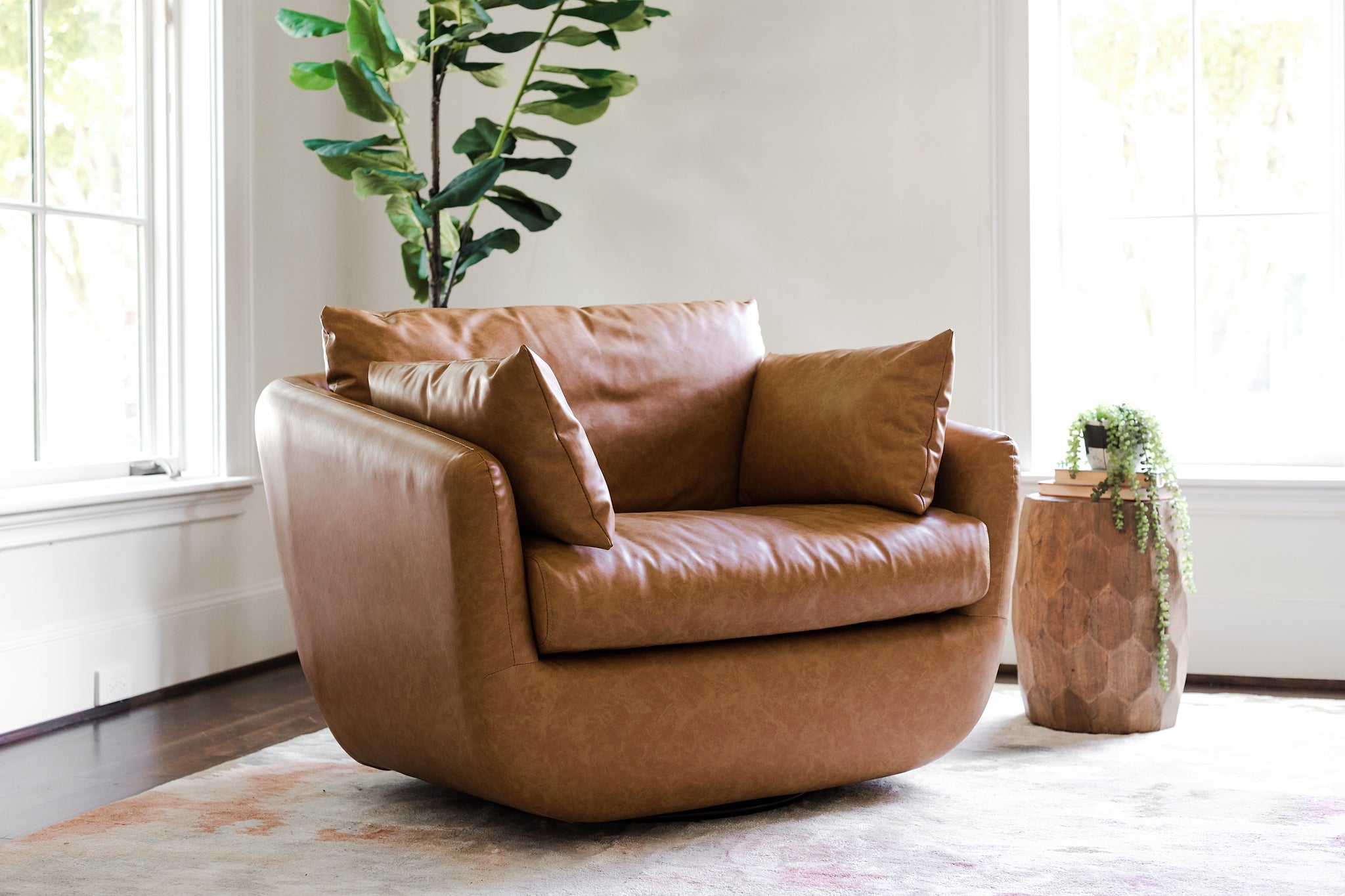 park swivel armchair in distressed vegan leather in a living room setting