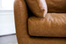 distressed vegan leather | detail of the armrest of the park swivel armchair in distressed vegan leather