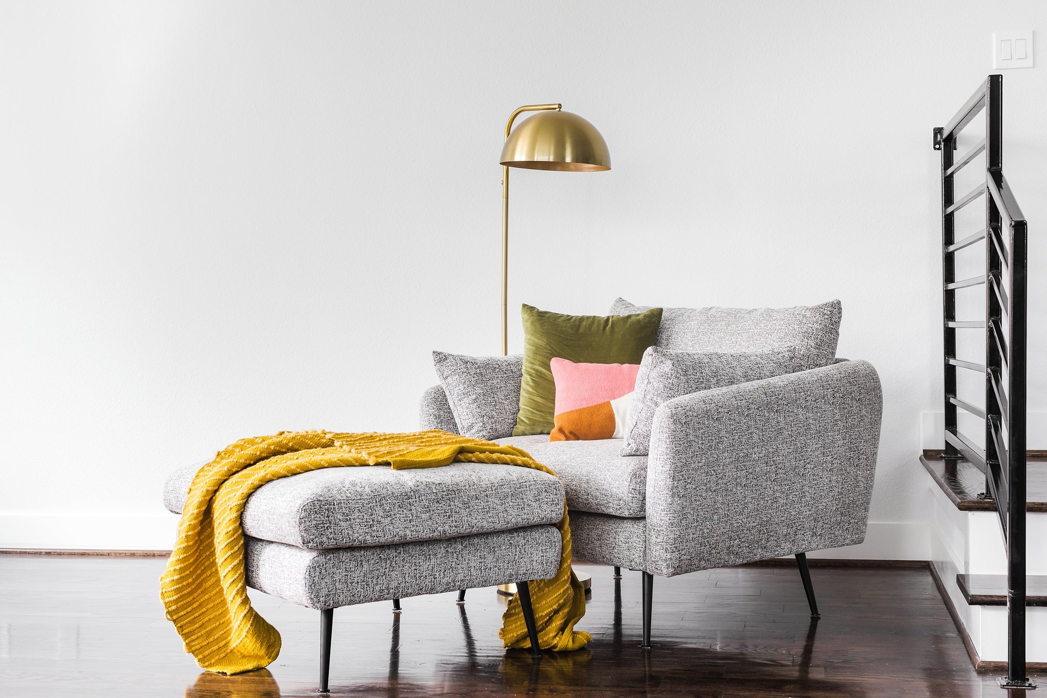 park ottoman shown in grey fabric with black legs