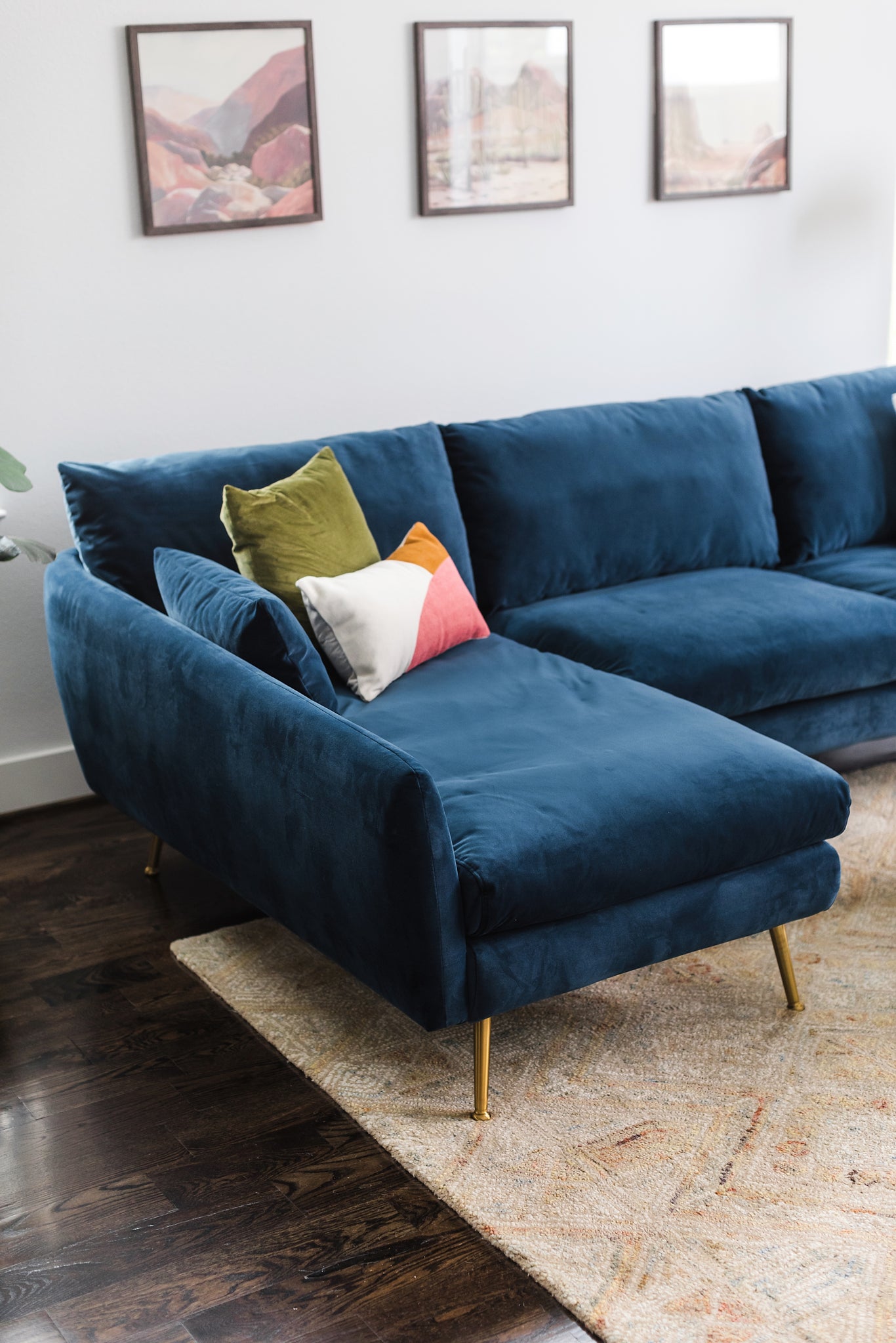 park sectional sofa shown in blue velvet with gold legs left facing