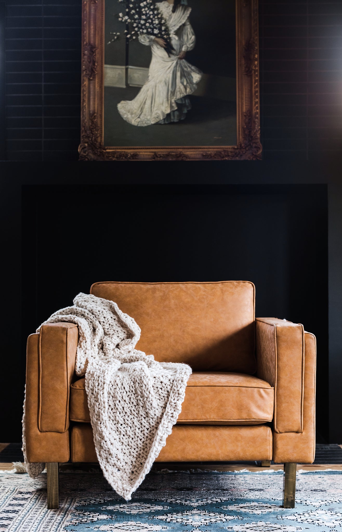 albany armchair shown in distressed vegan leather with gold legs