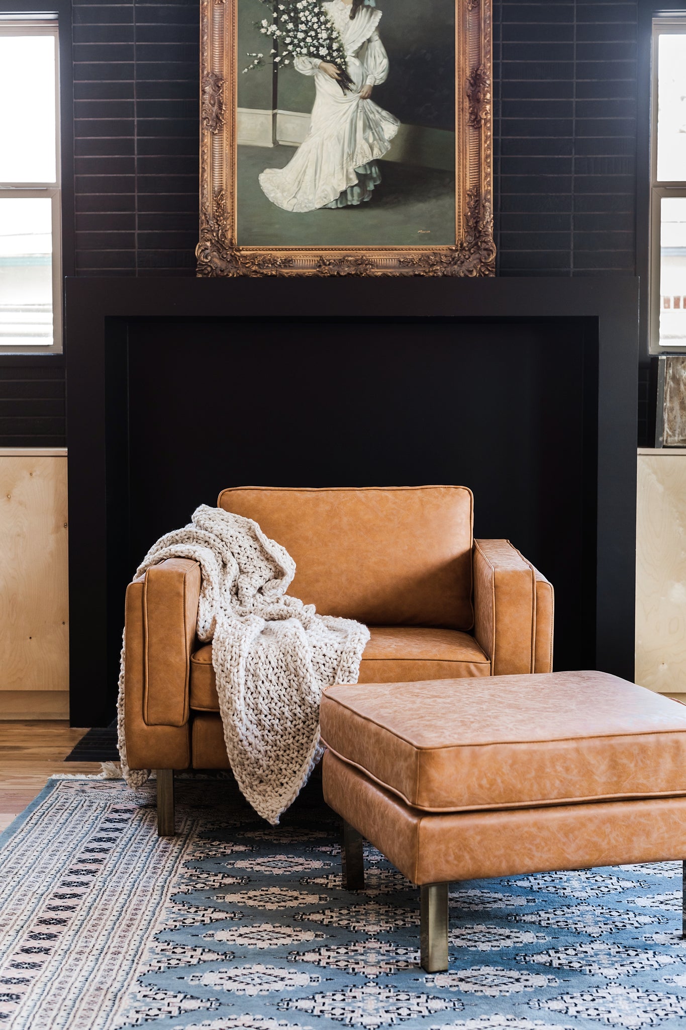 albany ottoman shown in distressed vegan leather with gold legs