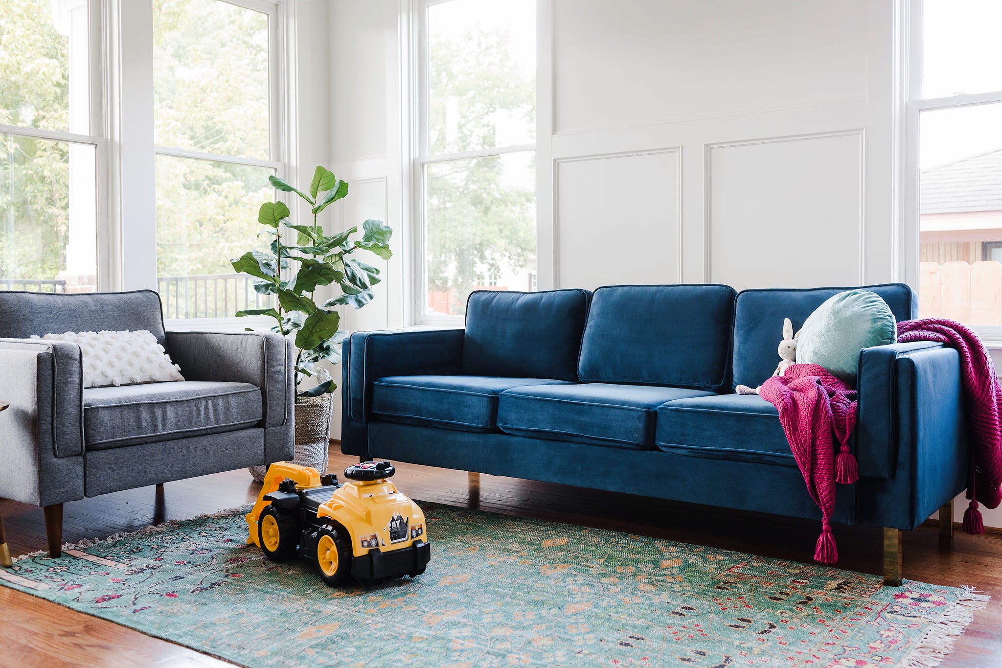 albany sofa shown in blue velvet with gold legs
