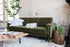 olive velvet walnut | Albany sleeper sofa in olive velvet with walnut legs with two pillows and a blanket on top