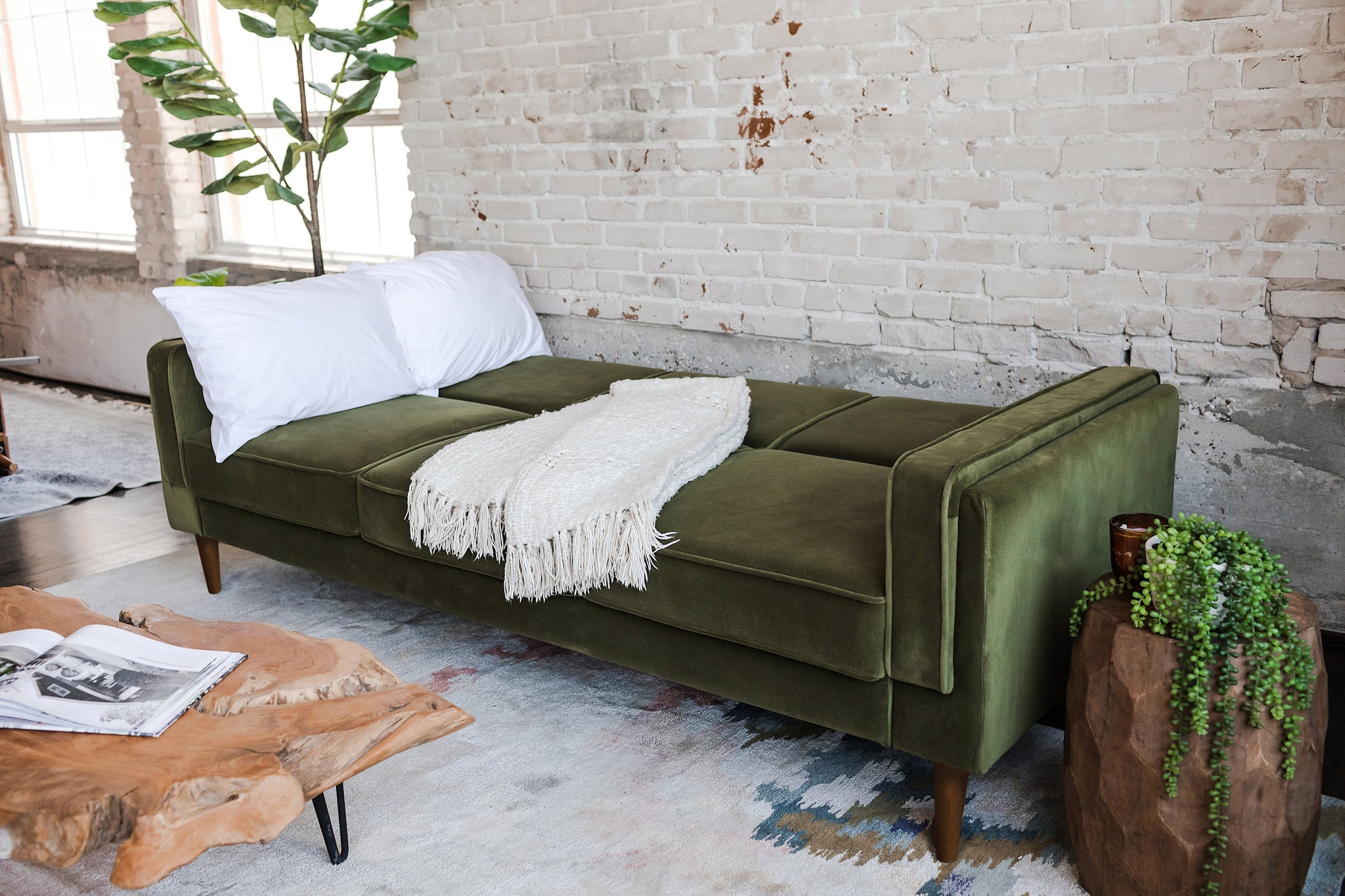 albany sleeper sofa in olive velvet with walnut legs as a bed