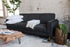 charcoal gold | Albany sleeper sofa in charcoal with gold legs with two pillows and a blanket on top