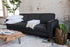 charcoal walnut | Albany sleeper sofa in charcoal with walnut legs with two pillows and a blanket on top