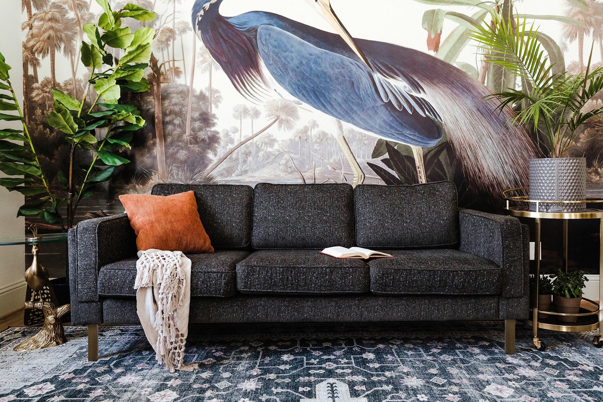 albany sofa shown in charcoal with gold legs