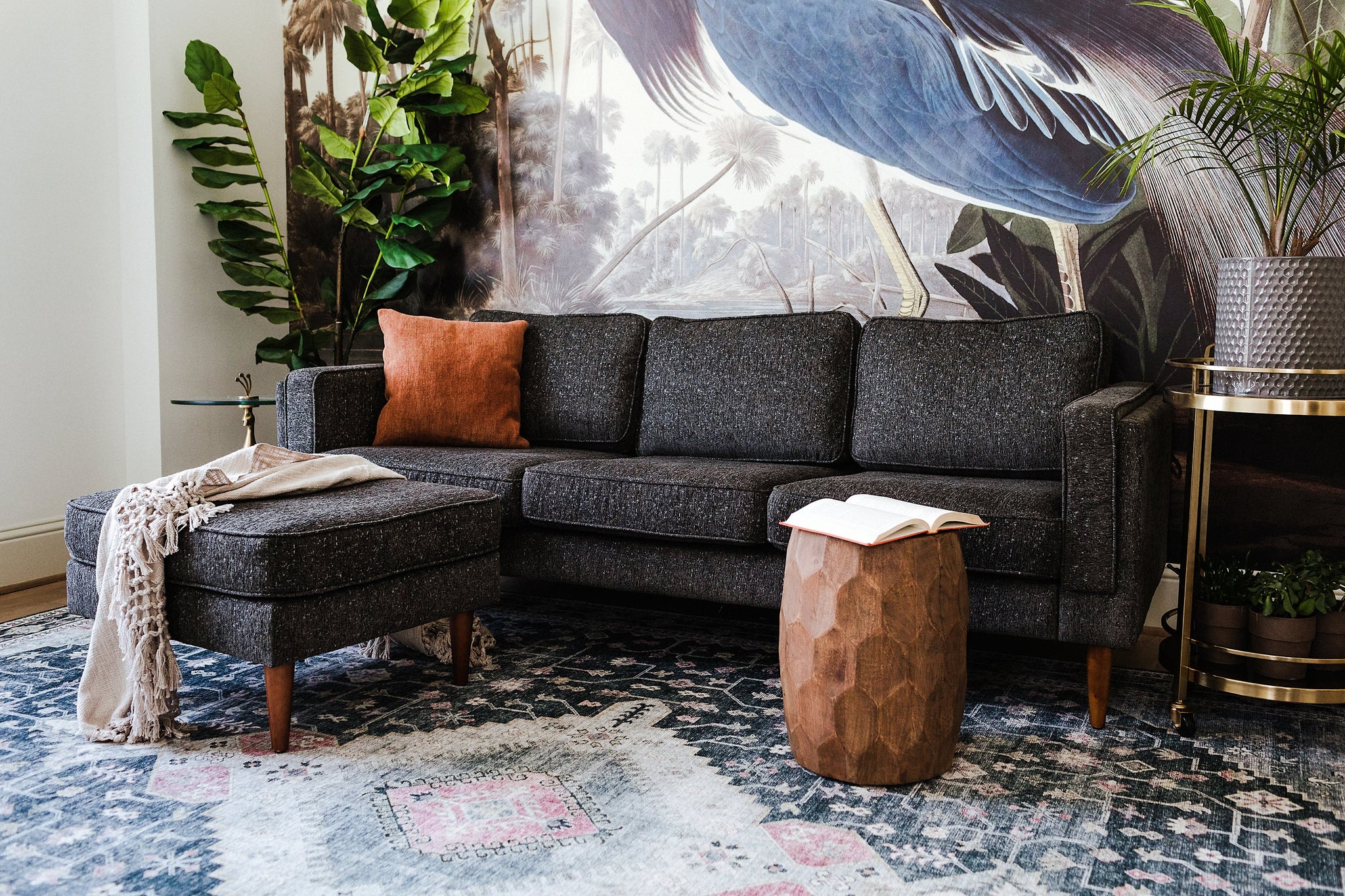 albany ottoman shown in charcoal with gold legs with walnut legs