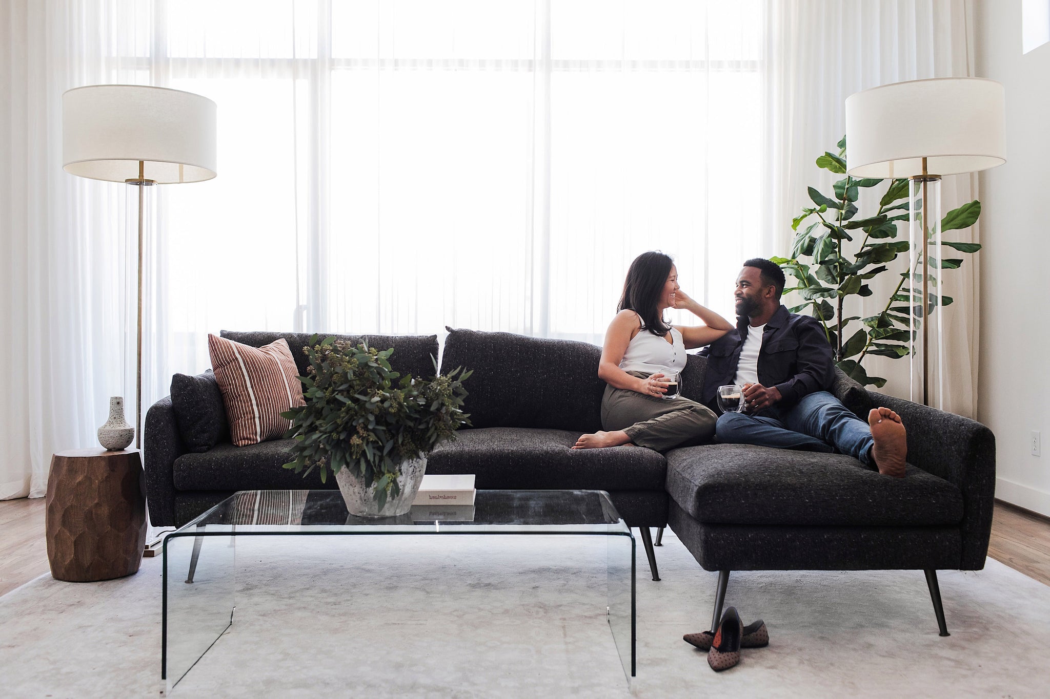 park sectional sofa shown in charcoal with gold legs with black legs right facing