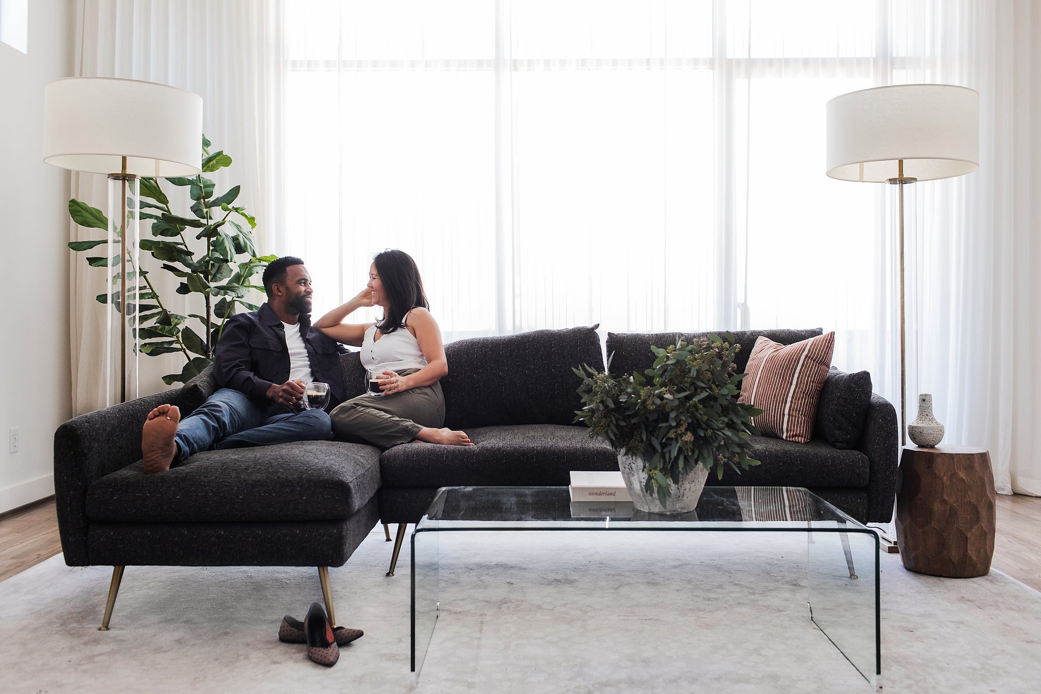 park sectional sofa shown in charcoal with gold legs with black legs left facing