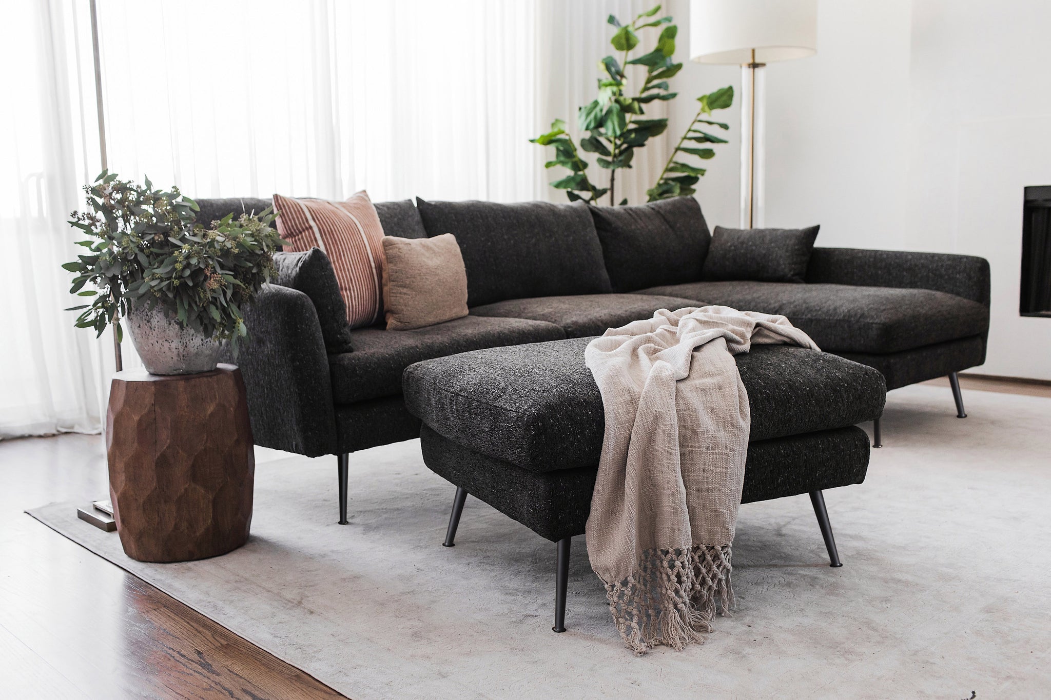 park sectional sofa shown in charcoal with gold legs with black legs right facing