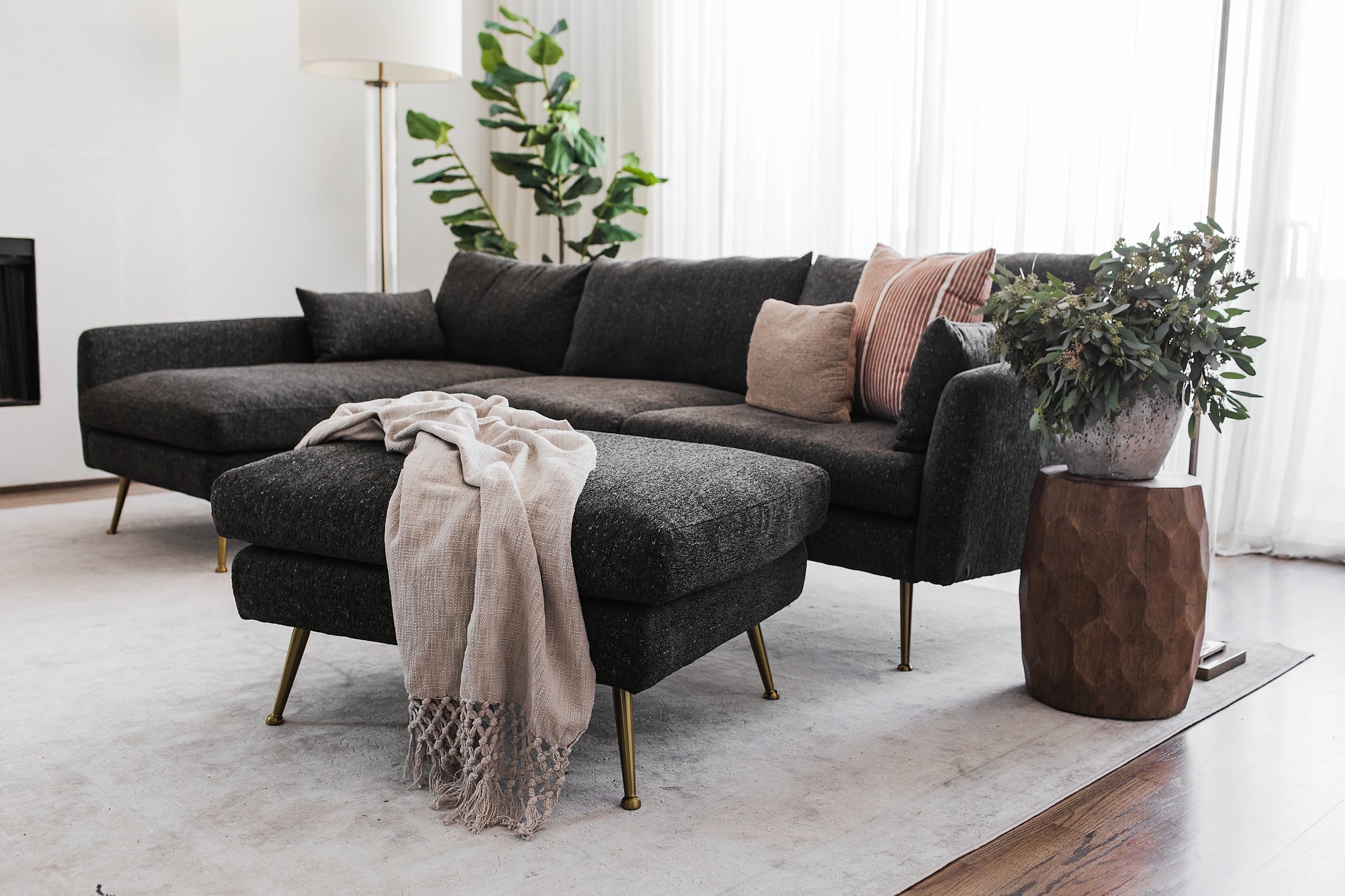 park sectional sofa shown in charcoal with gold legs with black legs left facing
