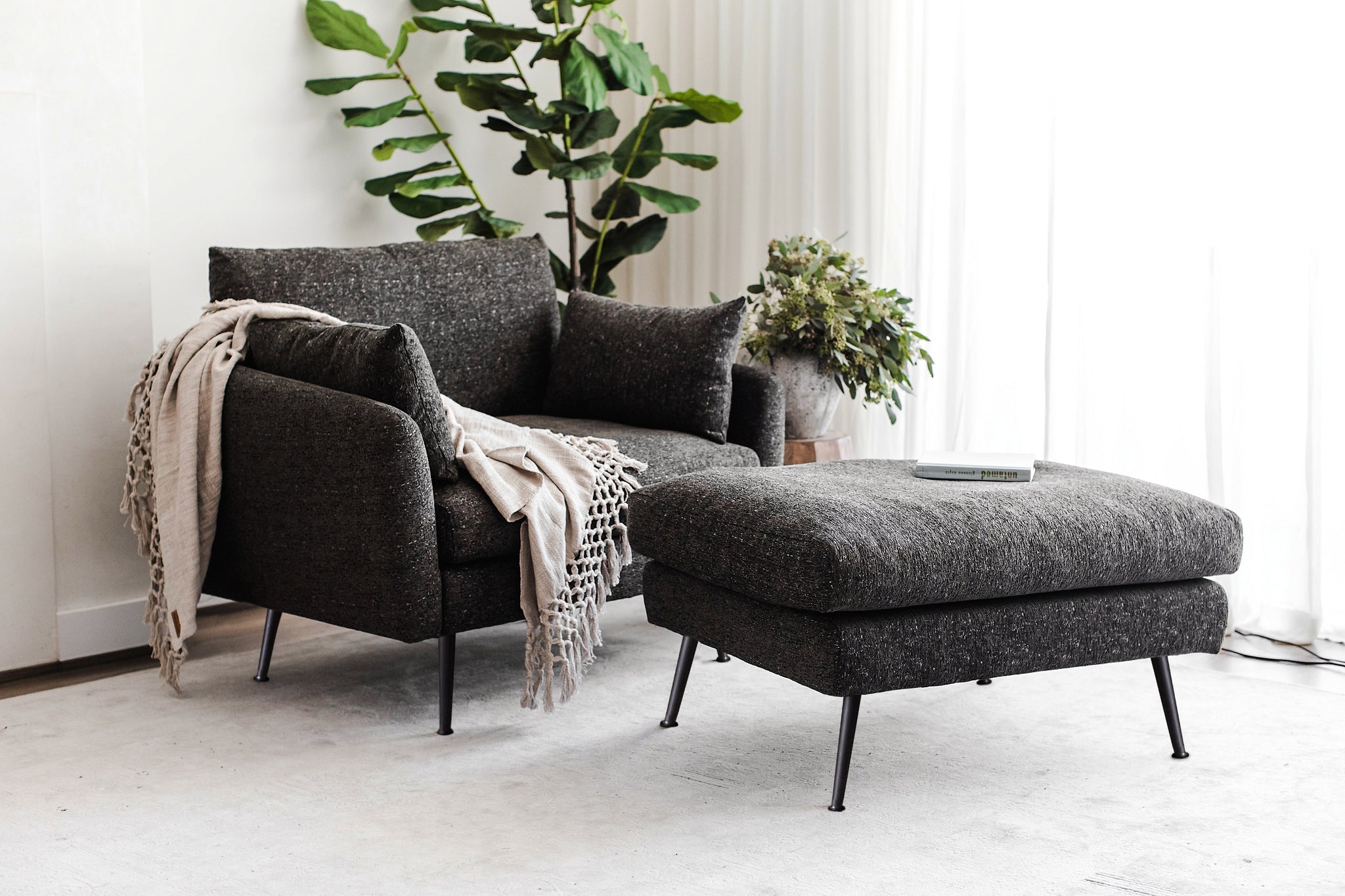 park armchair shown in charcoal with black legs