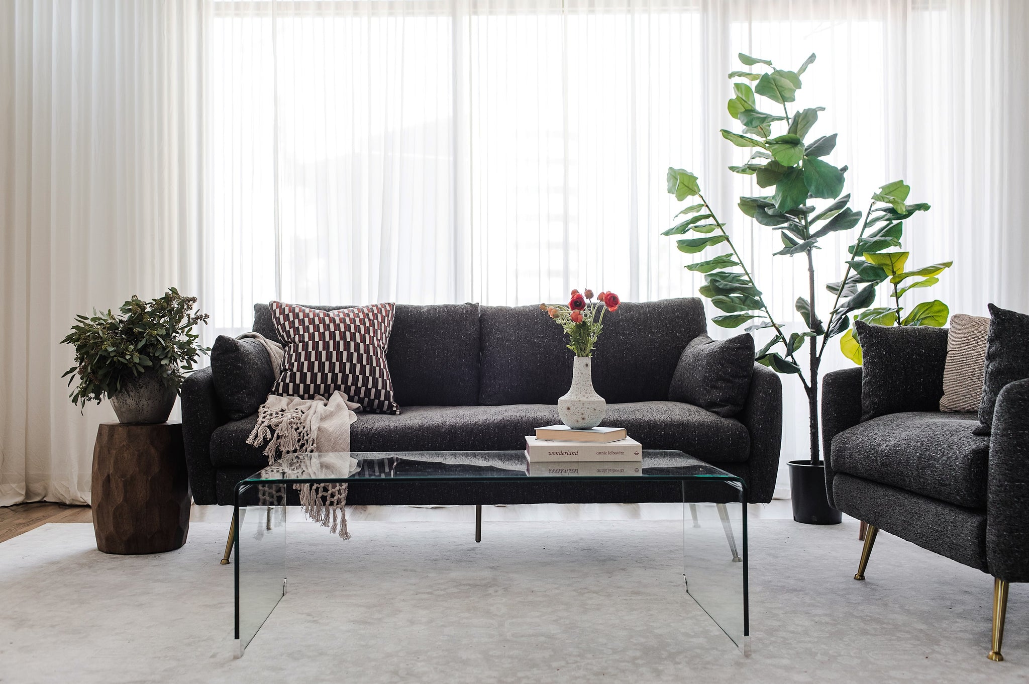 park sofa shown in charcoal with gold legs