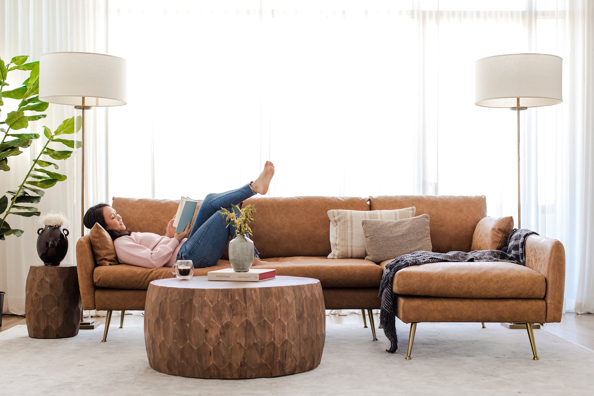 park sectional sofa shown in distressed vegan leather with gold legs right facing