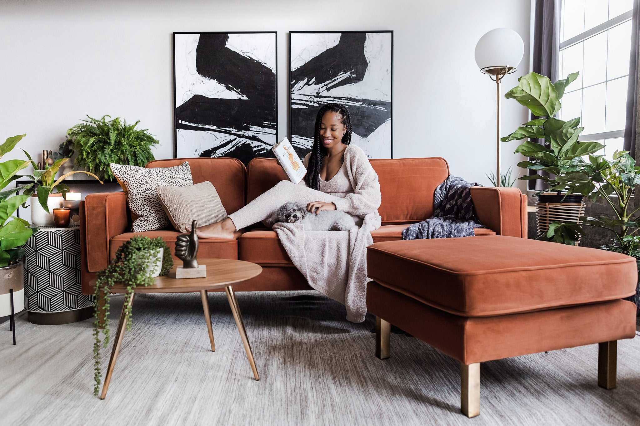 albany ottoman shown in rust velvet with gold legs