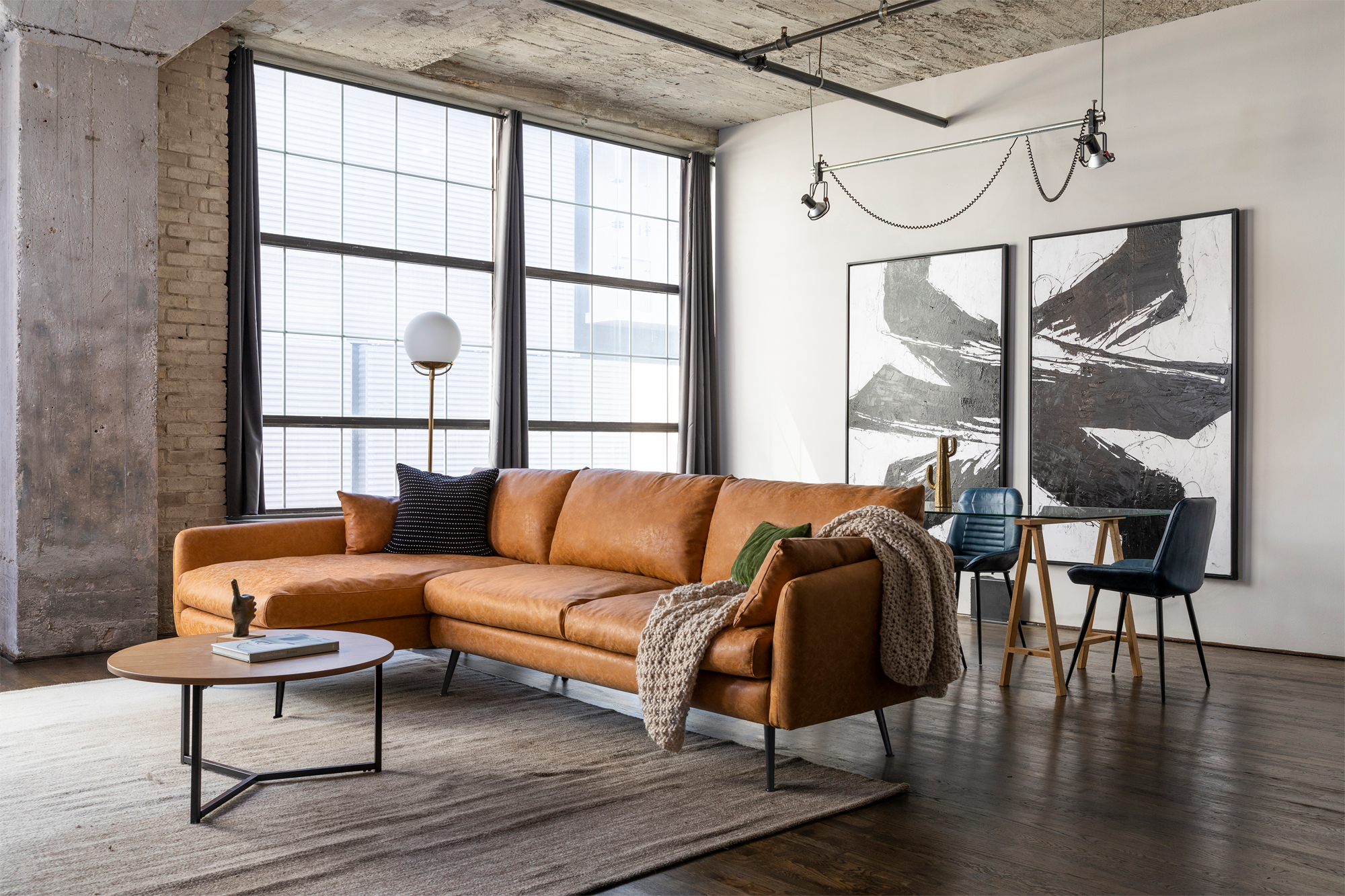 park sectional sofa shown in distressed vegan leather with black legs left facing