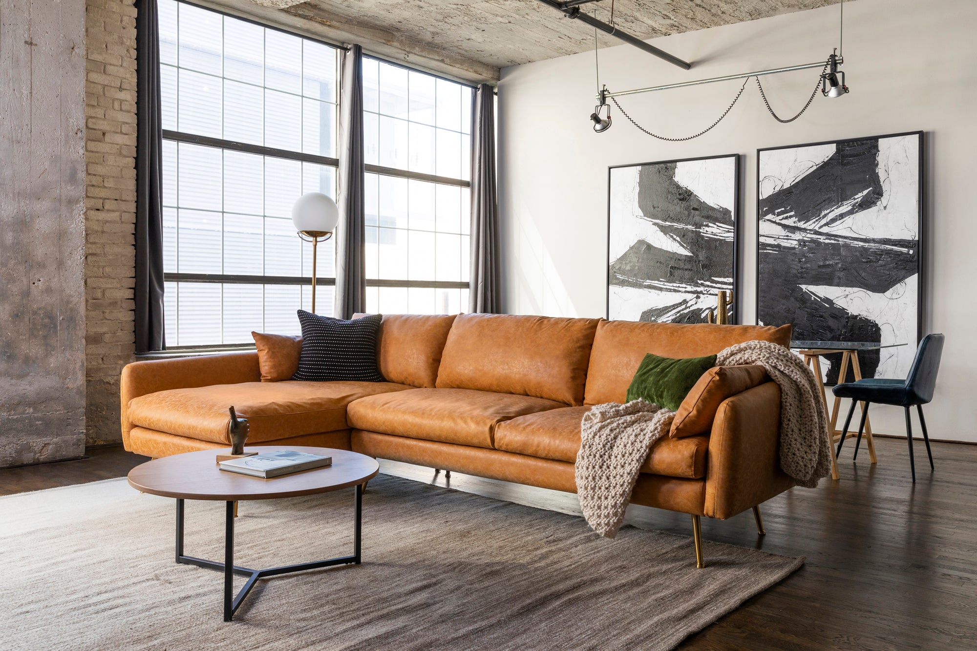park sectional sofa shown in distressed vegan leather with gold legs left facing