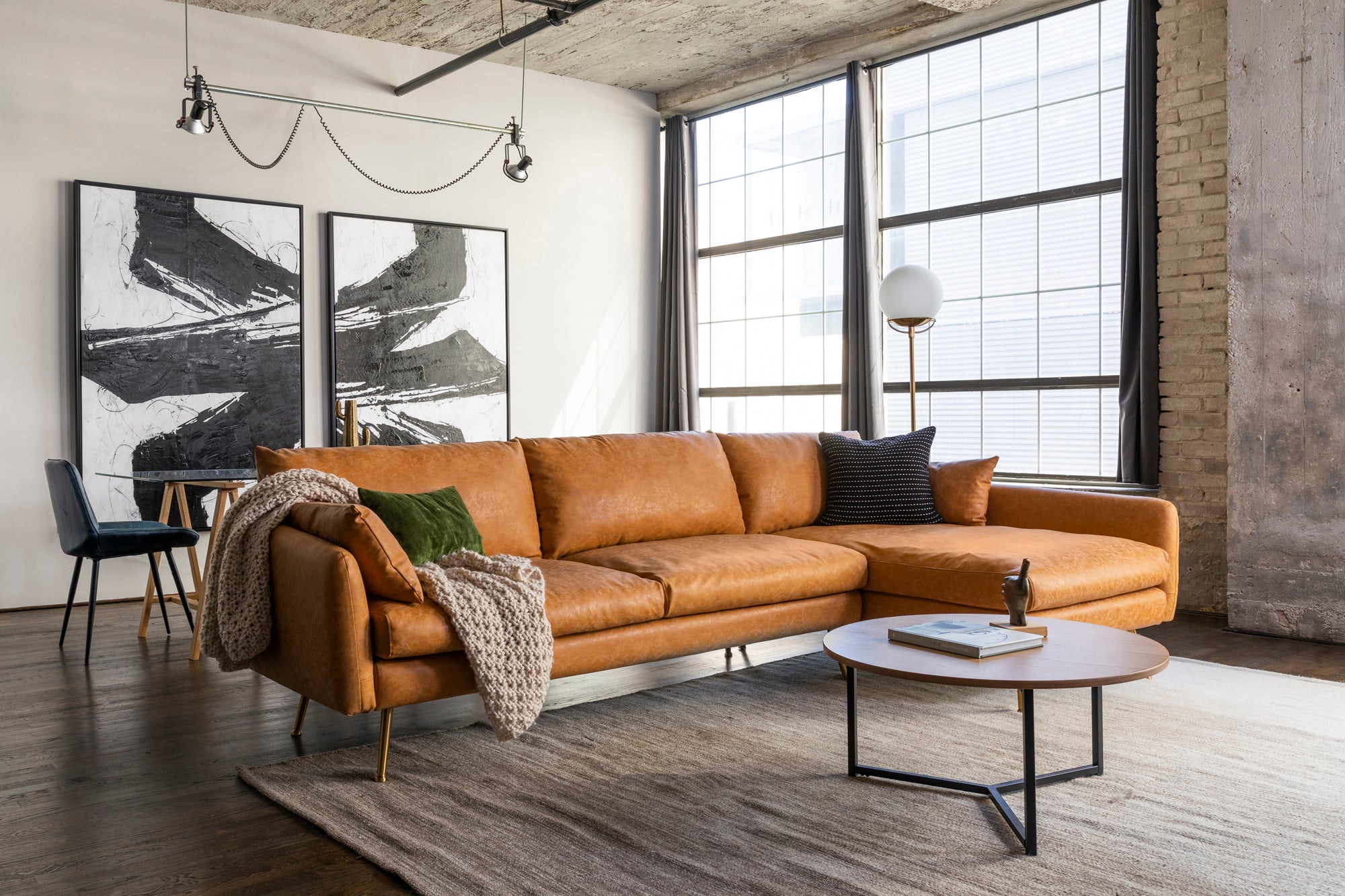 park sectional sofa shown in distressed vegan leather with gold legs right facing