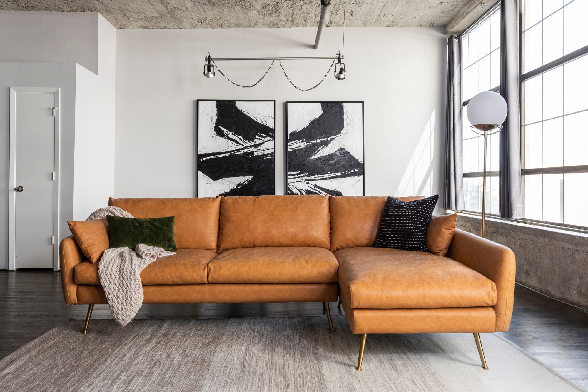 park sectional sofa shown in distressed vegan leather with gold legs right facing