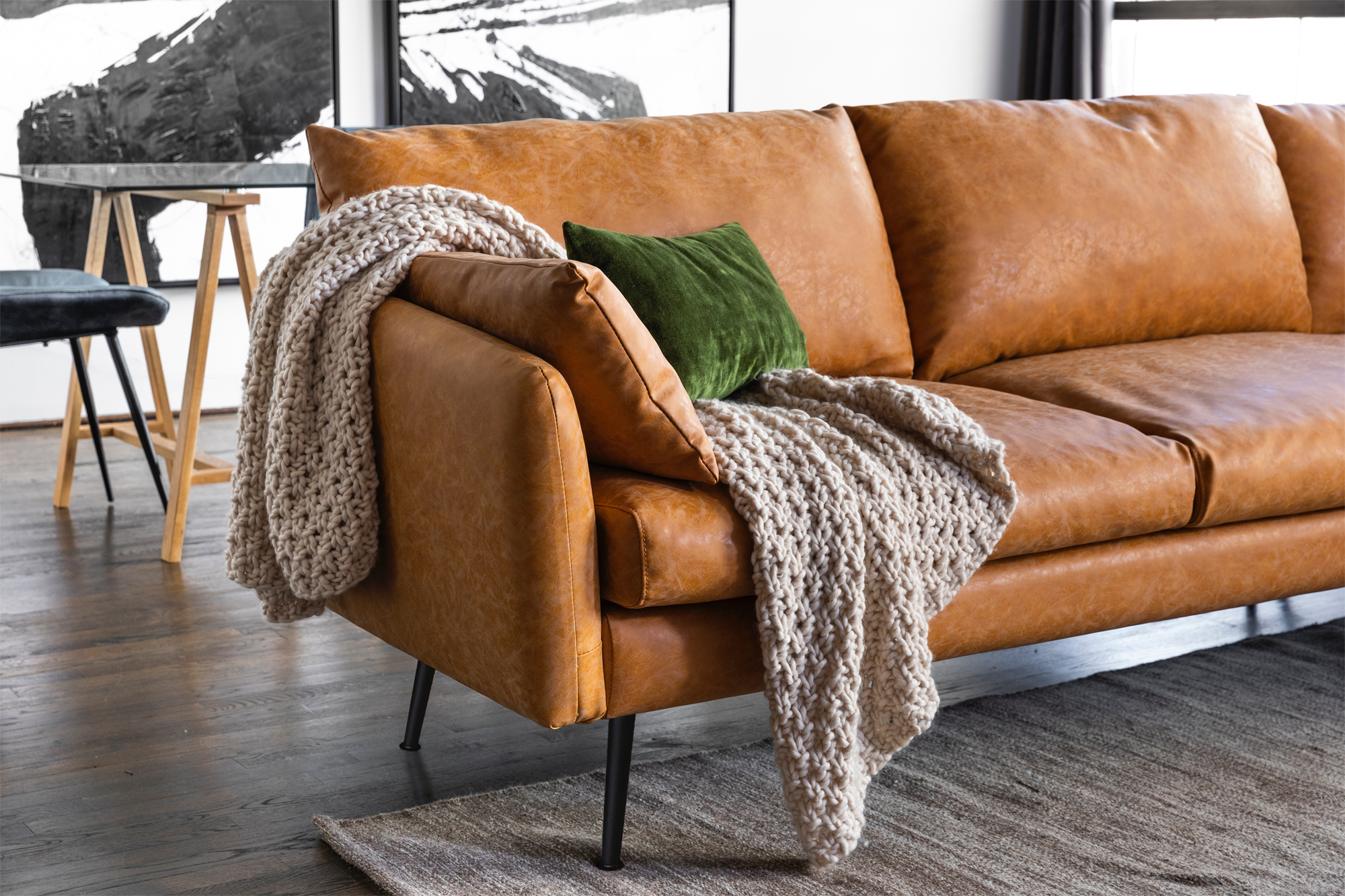 park sectional sofa shown in distressed vegan leather with black legs right facing